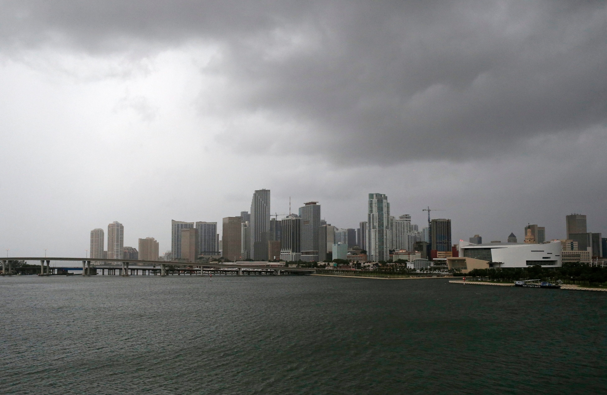 Clouds cover the Miami skyline as the outer bands of Hurricane Irma reached South Florida early Saturday, Sept. 9, 2017 in Miami. Gov. Rick Scott is urging anyone living in an evacuation zone in southwest Florida to leave by noon as the threat of Hurricane Irma has shifted west.  (David Santiago/Miami Herald via AP) USA HURRIKAN IRMA
