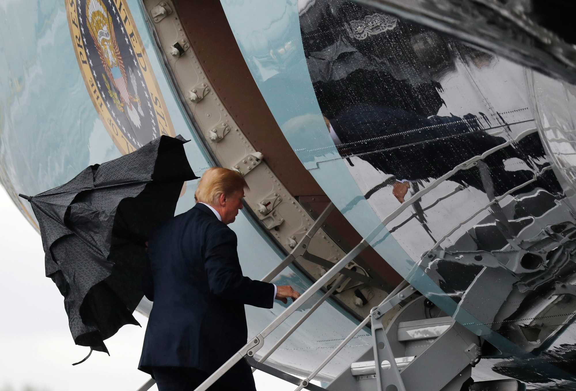 U.S. President Donald Trump boards Air Force One when departing from Glasgow, Scotland, on his way to Helsinki, Finland, Sunday, July 15, 2018 on the eve of his meeting with Russian President Vladimir Putin. (AP Photo/Pablo Martinez Monsivais) Finland Trump Putin Summit