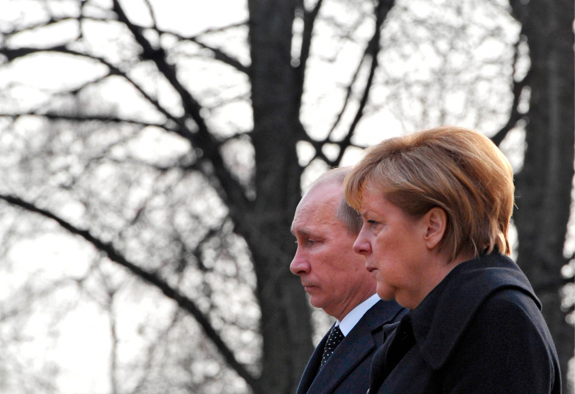 German Chancellor Angela Merkel, right, and Russian President Vladimir Putin lay a wreath at the Cemetery of Honor on the north bank of the Maschsee Lake in Hannover, central Germany, on Monday, April 8, 2013. Buried in this cemetery are 386 forced laborers from all over Europe, who were murdered by the Nazi regime near the end of the second World War in Hannover. (AP Photo/RIA Novosti, Alexei Druzhinin, Presidential Press Service, Pool) Germany Russia