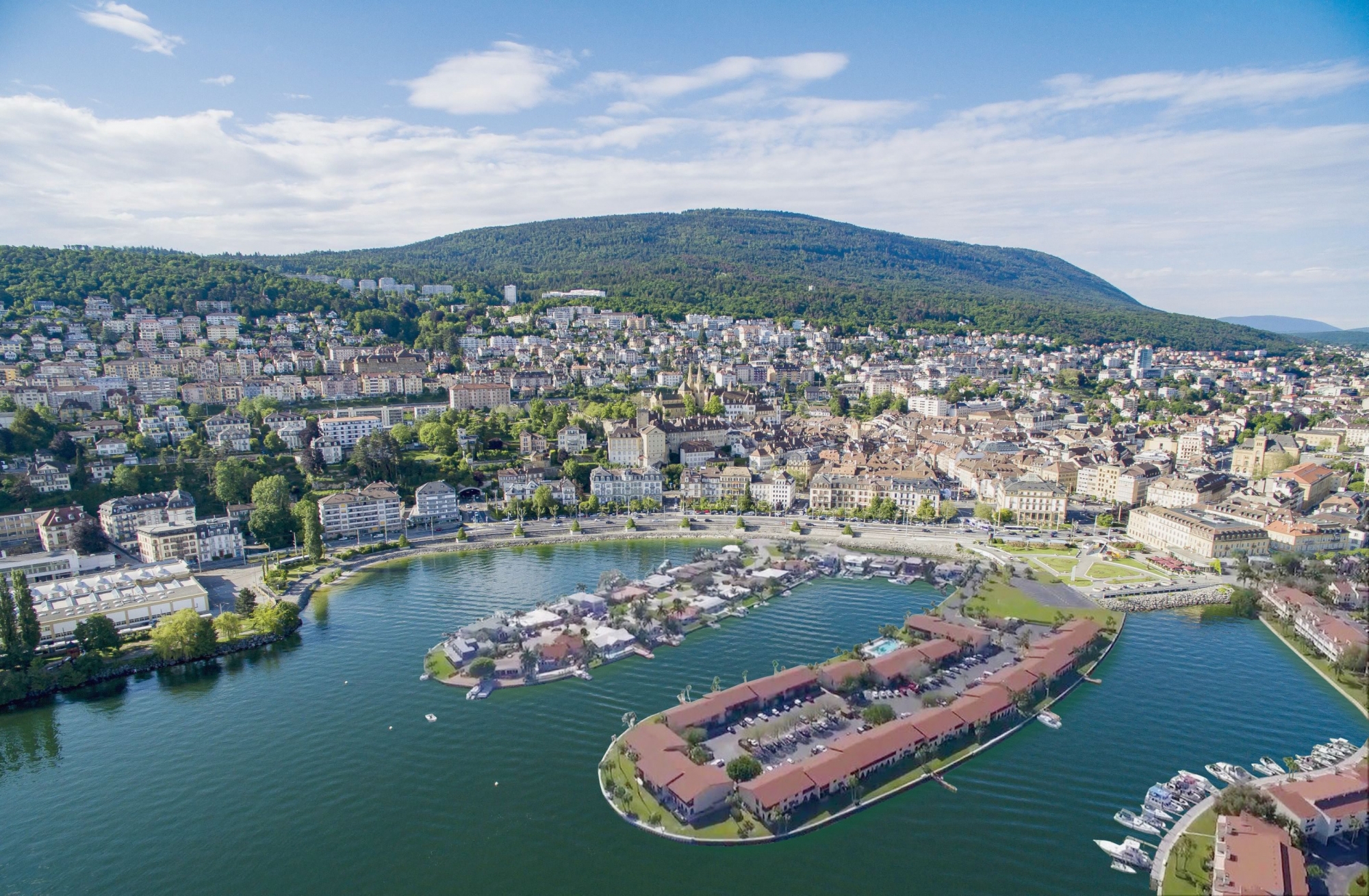 Illustration de ce à quoi pourrait ressembler la baie de l'Evole avec des nouveaux quartiers sur le lac. 