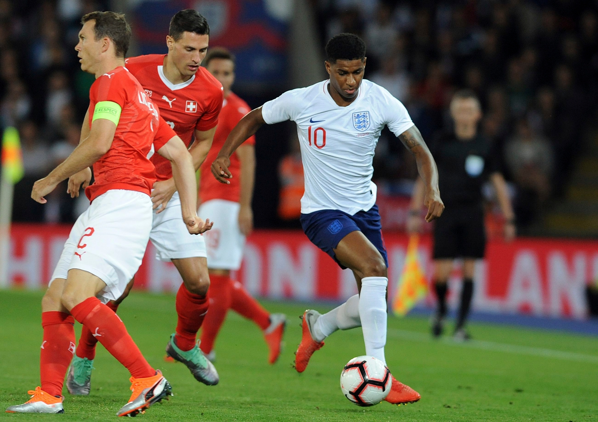 England's Marcus Rashford, right, goes with the ball during the International friendly soccer match between England and Switzerland at the King Power Stadium in Leicester, England, Tuesday, Sept. 11, 2018 . (AP Photo/ Rui Vieira) Britain England Switzerland Soccer