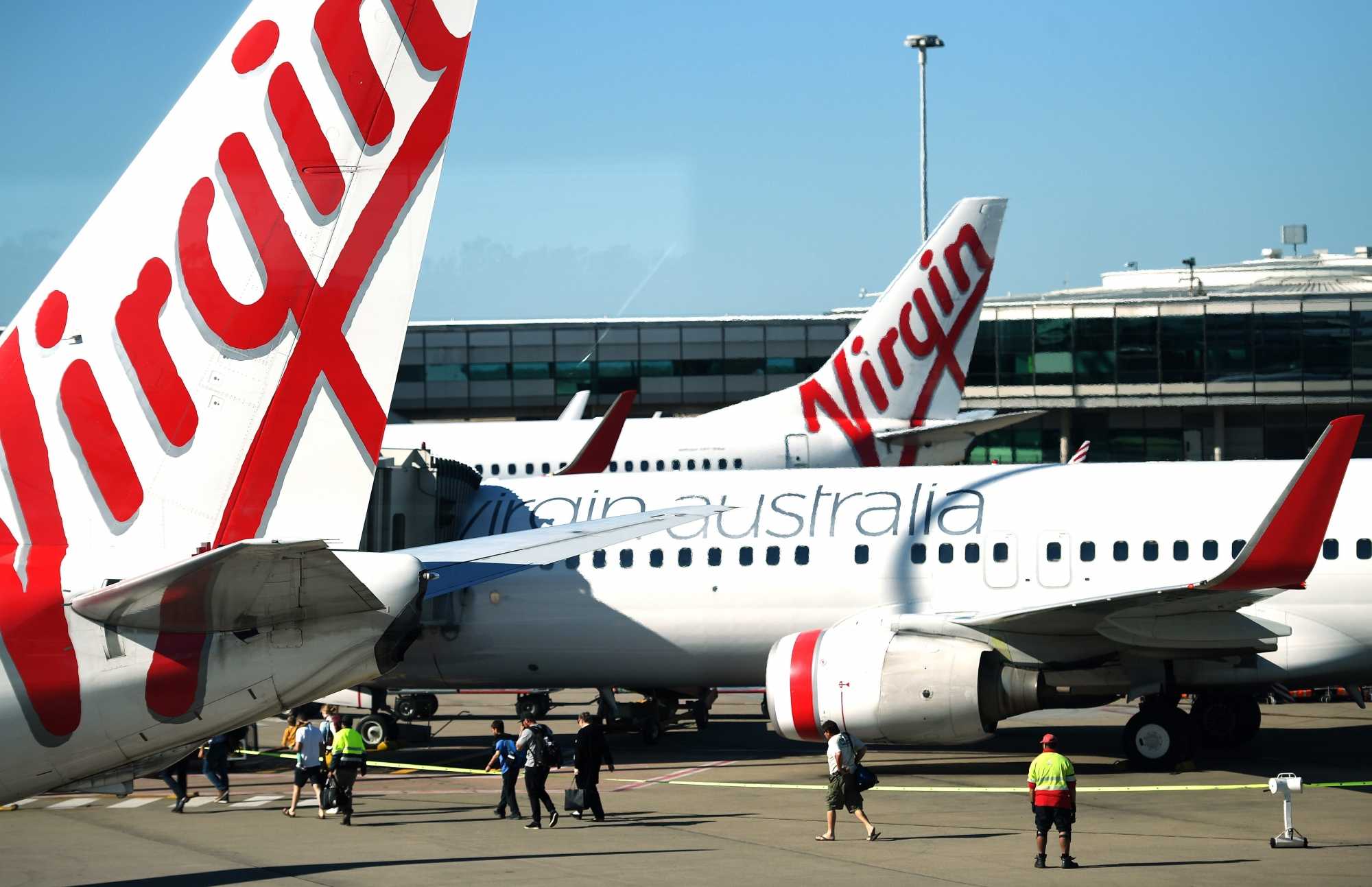 epa06980306 Virgin Australia aircraft at Brisbane Airport, in Brisbane, Australia, 29 August 2018. According to media reports on 29 August 2018, Virgin Australia posted a full-year loss of 681 million Australian dollar (497.78 million US dollar).  EPA/DAN PELED  AUSTRALIA AND NEW ZEALAND OUT AUSTRALIA VIRGIN FULL YEAR RESULTS