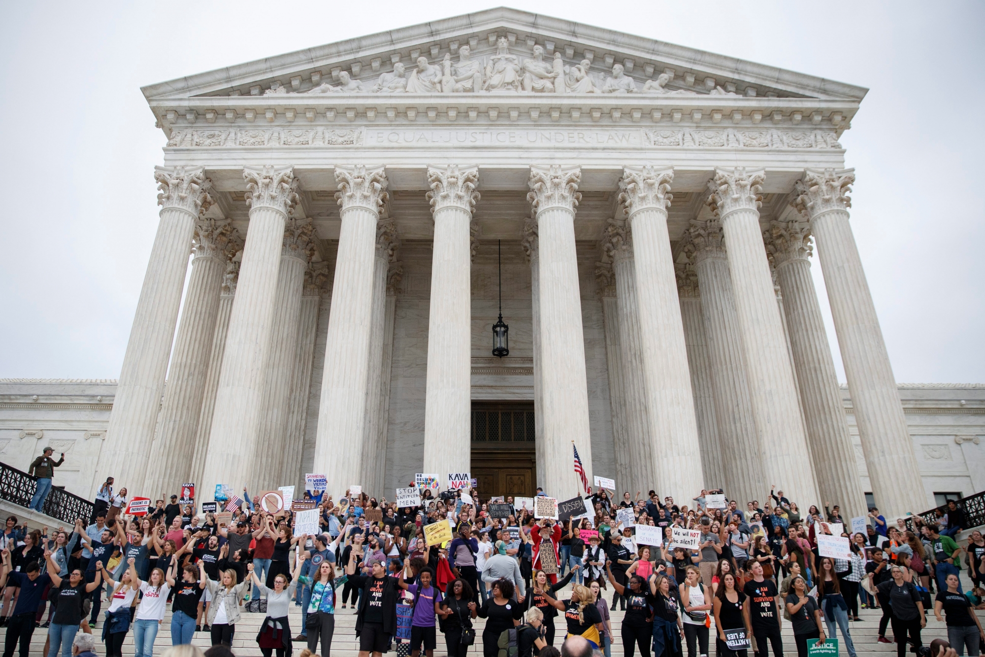 epaselect epa07075136 Activist protest the Senate confirmation of Supreme Court nominee Brett Kavanaugh on the steps of the Supreme Court in Washington, DC, USA, 06 October 2018. Media reports on 06 October 2018 that the US Supreme Court nominee Brett Kavanaugh has been elected to the Supreme Court by the US Senate that voted in favour 50 to 48.  EPA/SHAWN THEW epaselect USA GOVERNMENT SENATE KAVANAUGH