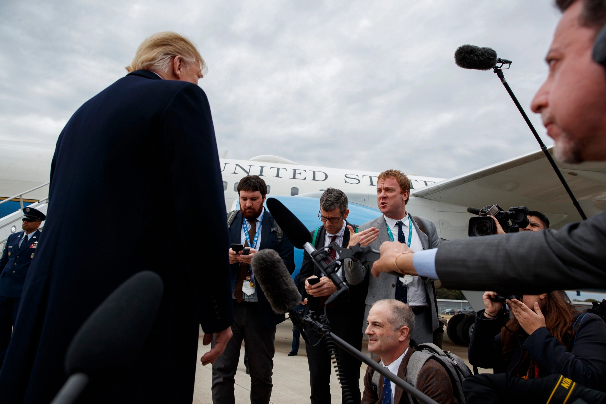 President Donald Trump listens to a question about the missing Saudi journalist Jamal Khashoggi after landing at Cincinnati Municipal Lunken Airport, Friday, Oct. 12, 2018, in Cincinnati, Ohio. (AP Photo/Evan Vucci) Trump