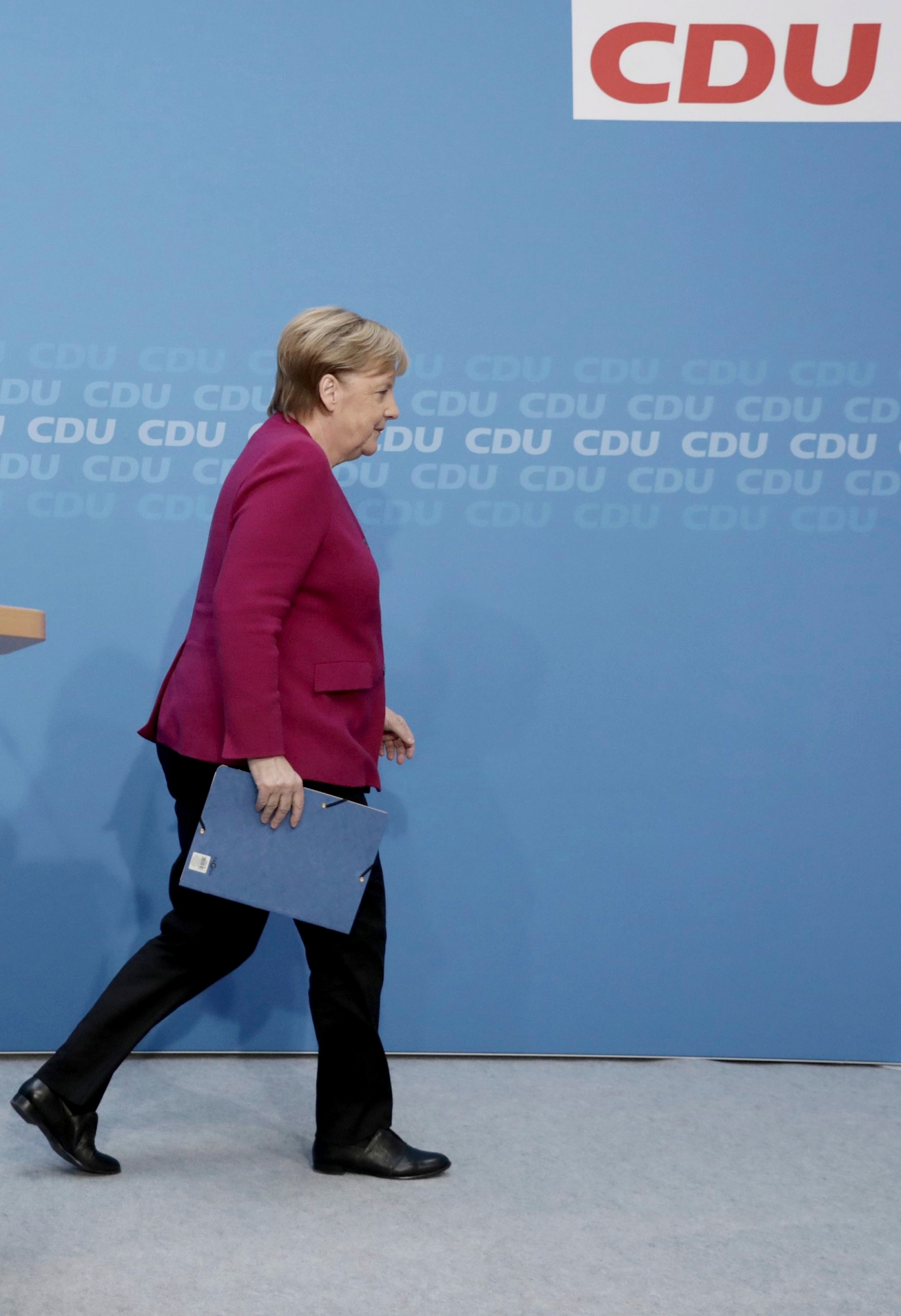 German Christian Democratic Party, CDU, chairwoman and Chancellor Angela Merkel leaves the podium after a news conference following a party's leaders meeting at the headquarters the in Berlin, Germany, Monday, Oct. 29, 2018. (Kay Nietfeld/dpa via AP) Germany Election