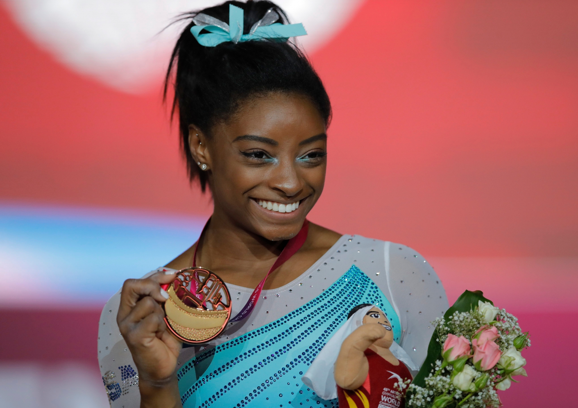 Gold medallist and four-times All-Around world champion Simone Biles of the U.S., poses on the podium after the Women's All-Around Final of the Gymnastics World Chamionships at the Aspire Dome in Doha, Qatar, Thursday, Nov. 1, 2018. (AP Photo/Vadim Ghirda) Qatar Gymnastics World Championships