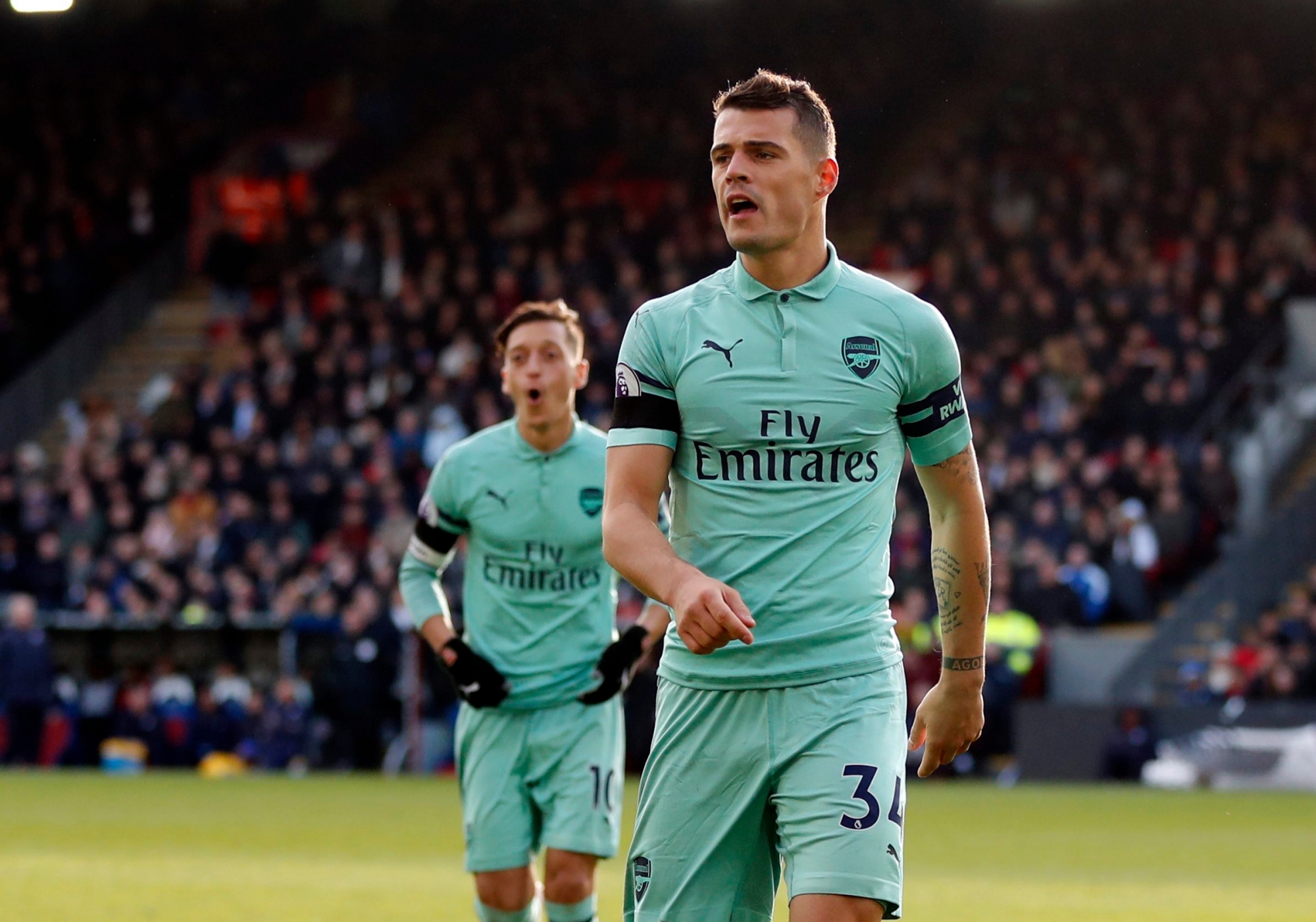 Arsenal's Granit Xhaka celebrates after scoring his side's first goal of the game during the English Premier League soccer match between Crystal Palace and Arsenal at Selhurst Park, London, Sunday, Oct. 28, 2018. (AP Photo/Frank Augstein) Britain Soccer Premier League