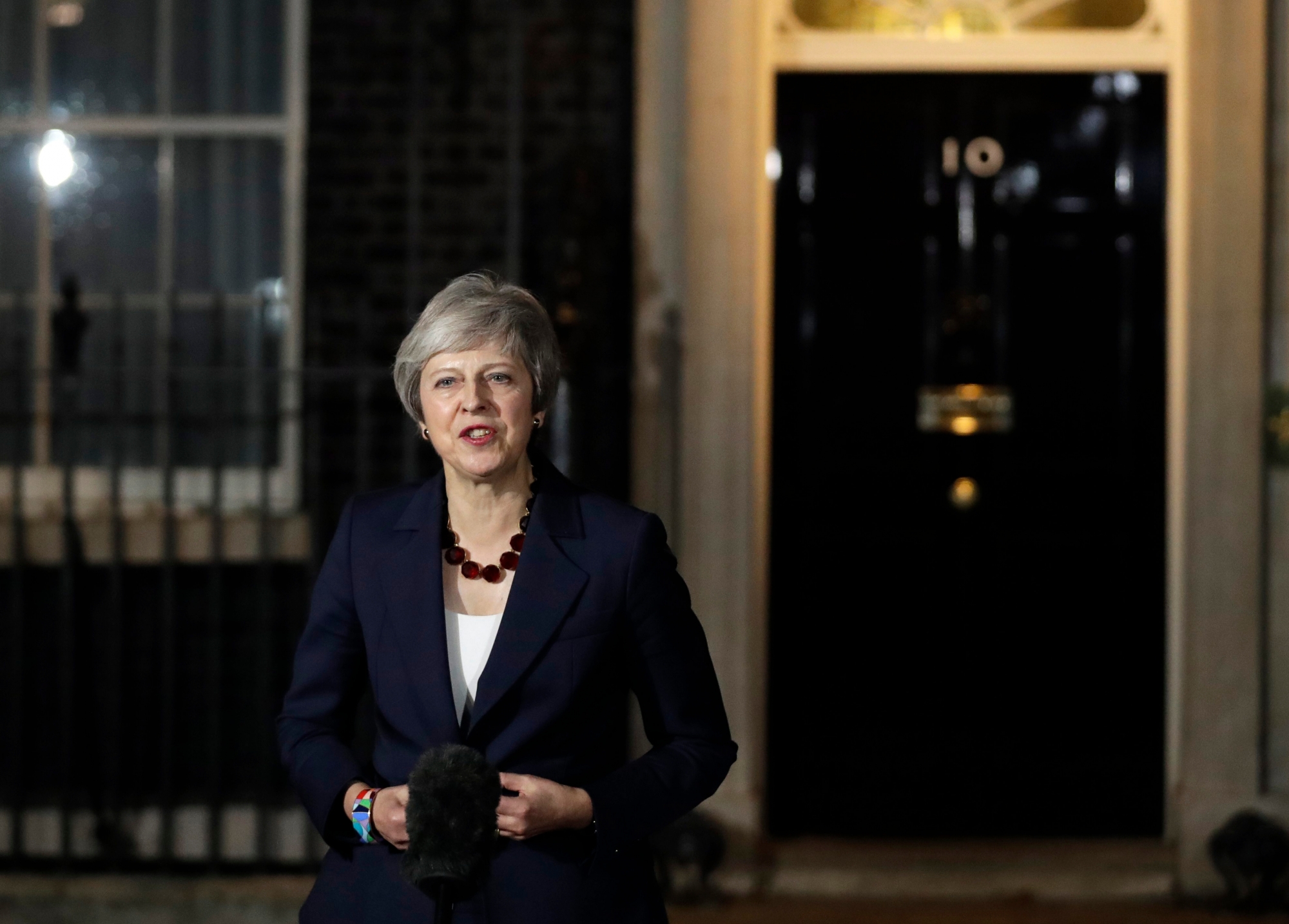 Britain's Prime Minister Theresa May delivers a speech outside 10 Downing Street in London, Wednesday, Nov. 14, 2018. British Prime Minister Theresa May says Cabinet agrees draft Brexit deal with European Union after 'impassioned' debate. (AP Photo/Matt Dunham) Britain Brexit