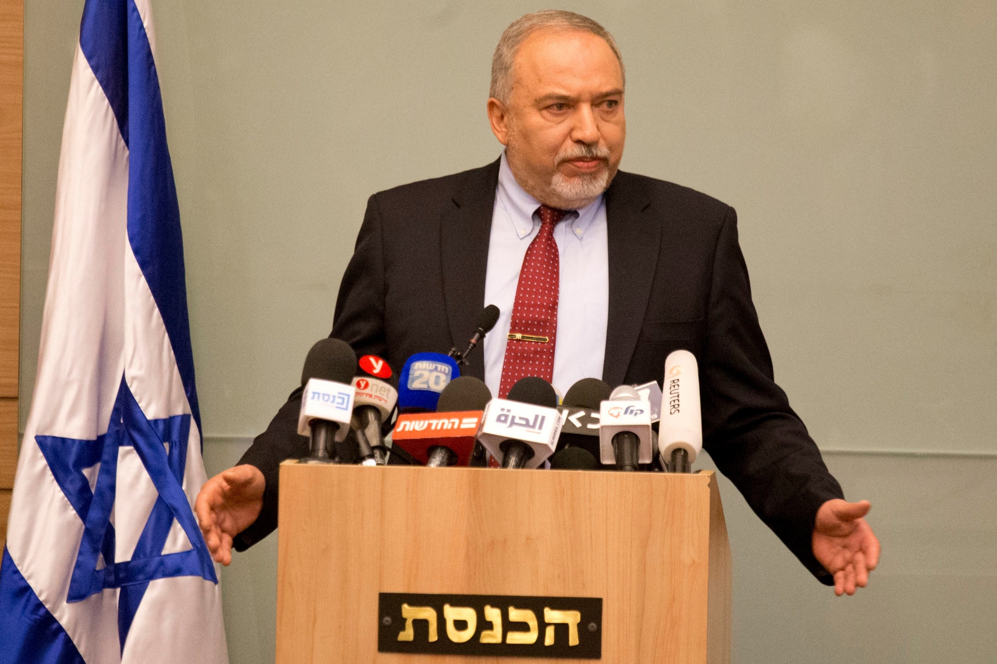 Israeli Defense Minister Avigdor Lieberman delivers a statement at the Knesset, Israel's Parliament, in Jerusalem, Wednesday, Nov. 14, 2018. Lieberman announced his resignation Wednesday over the Gaza cease-fire, making early elections likely. (AP Photo/Ariel Schalit) Israel Lieberman