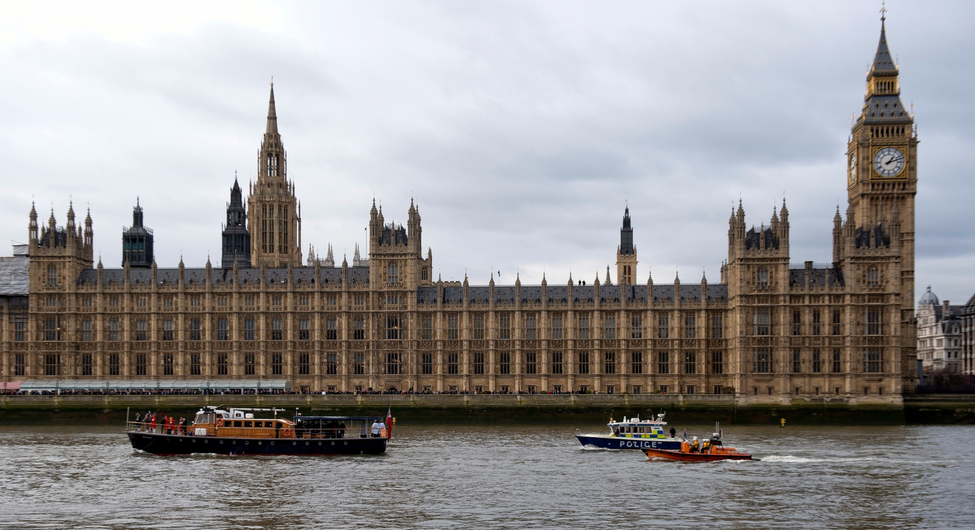 epa05863530 (FILE) - A file photograph showing 'The Havengore' (L), the vessel that carried the casket of Sir Winston Churchill during his state funeral in 1965, passes Houses of Parliament on Thames river in London, Britain, 30 January 2015. Scotland Yard said on 22 March 21017 the police were called to a firearms incident in the Westminister palace grounds and on Westminster Bridge amid reports of several people injured in central London.  EPA/WILL OLIVER (FILE) BRITAIN LONDON SHOTS FIRED NEAR PARLIAMENT