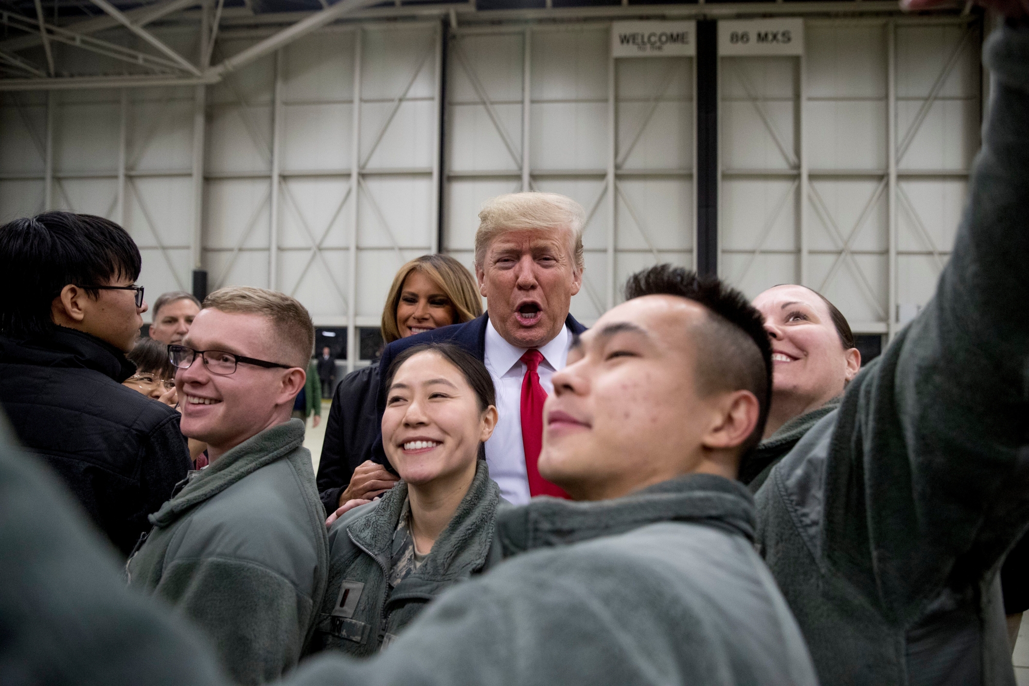 President Donald Trump and first lady Melania Trump greet members of the military at Ramstein Air Base, Germany, Thursday, Dec. 27, 2018. (AP Photo/Andrew Harnik) Trump Germany