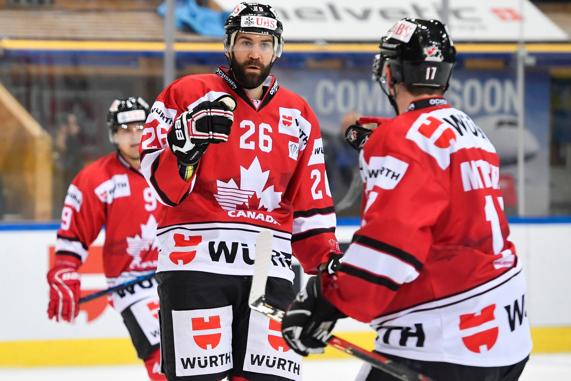 Team Canada's Daniel Winnik, center, am teammates celebrate after scoring 2-1 during the game between Team Canada and Thomas Sabo Ice Tigers at the 92th Spengler Cup ice hockey tournament in Davos, Switzerland, Friday, December 28, 2018. (KEYSTONE/Gian Ehrenzeller). EISHOCKEY SPENGLER CUP 2018 TEAM CANADA ICE TIGERS