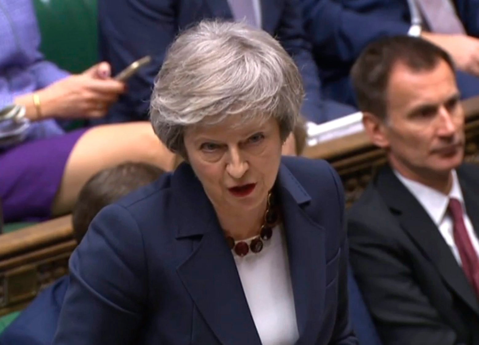 In this grab taken from video, Britain's Prime Minister Theresa May speaks during Prime Minister's Questions in the House of Commons, London, Wednesday, Jan. 9, 2019.  The British government brought its little-loved Brexit deal back to Parliament on Wednesday, a month after postponing a vote on the agreement to stave off near-certain defeat. (House of Commons/PA via AP) Britain Brexit