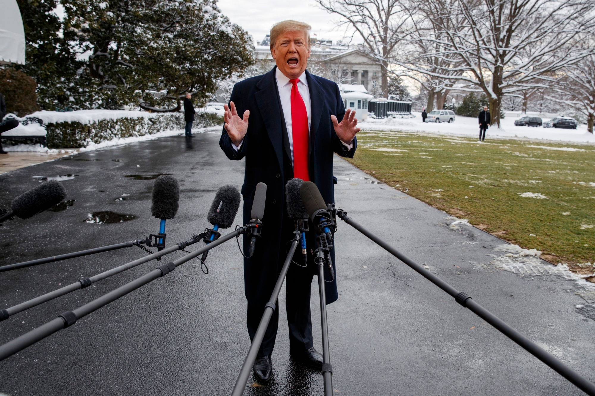 President Donald Trump talks with reporters on the South Lawn of the White House before departing for the American Farm Bureau Federation's 100th Annual Convention in New Orleans, Monday, Jan. 14, 2019, in Washington. (AP Photo/ Evan Vucci) Trump