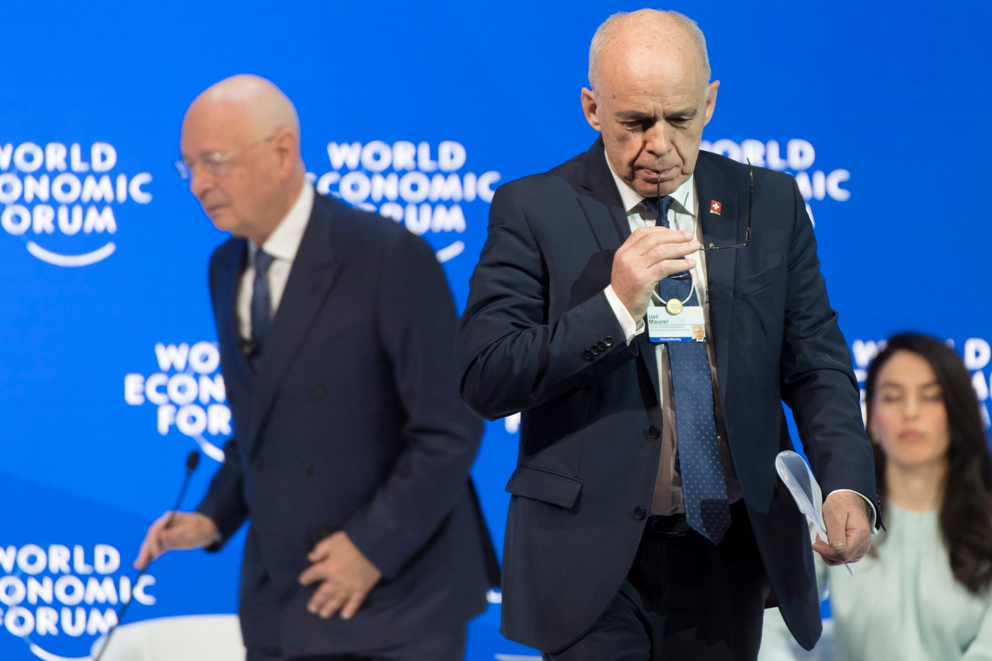 Swiss Federal President Ueli Maurer, right, leaves the stage next to German Klaus Schwab,, left, Founder and Executive Chairman of the World Economic Forum, WEF, after speaking during a plenary session in the Congress Hall the first day of the 49th Annual Meeting of the World Economic Forum, WEF, in Davos, Switzerland, Tuesday, January 22, 2019. The meeting brings together entrepreneurs, scientists, corporate and political leaders in Davos under the topic "Globalization 4.0" from 22 - 25 January 2019. (KEYSTONE/Laurent Gillieron) SWITZERLAND WORLD ECONOMIC FORUM WEF 2019
