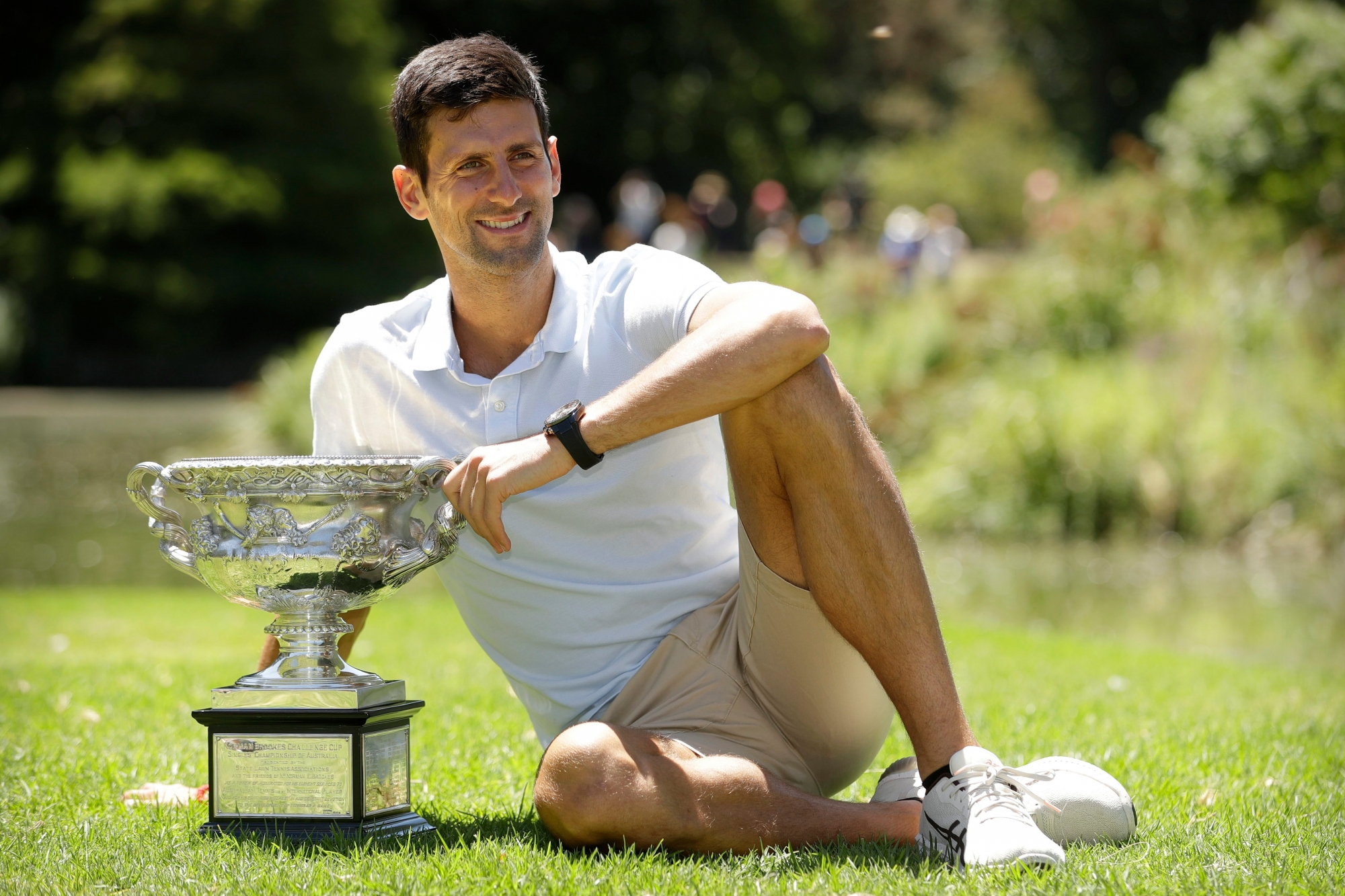 Serbia's Novak Djokovic poses with his trophy, the Norman Brookes Challenge Cup, at Melbourne's Royal Botanic Gardens following his win over Rafael Nadal of Spain in the men's singles final at the Australian Open tennis championships in Melbourne, Australia, Monday, Jan. 28, 2019. (AP Photo/Mark Schiefelbein) Australian Open Tennis