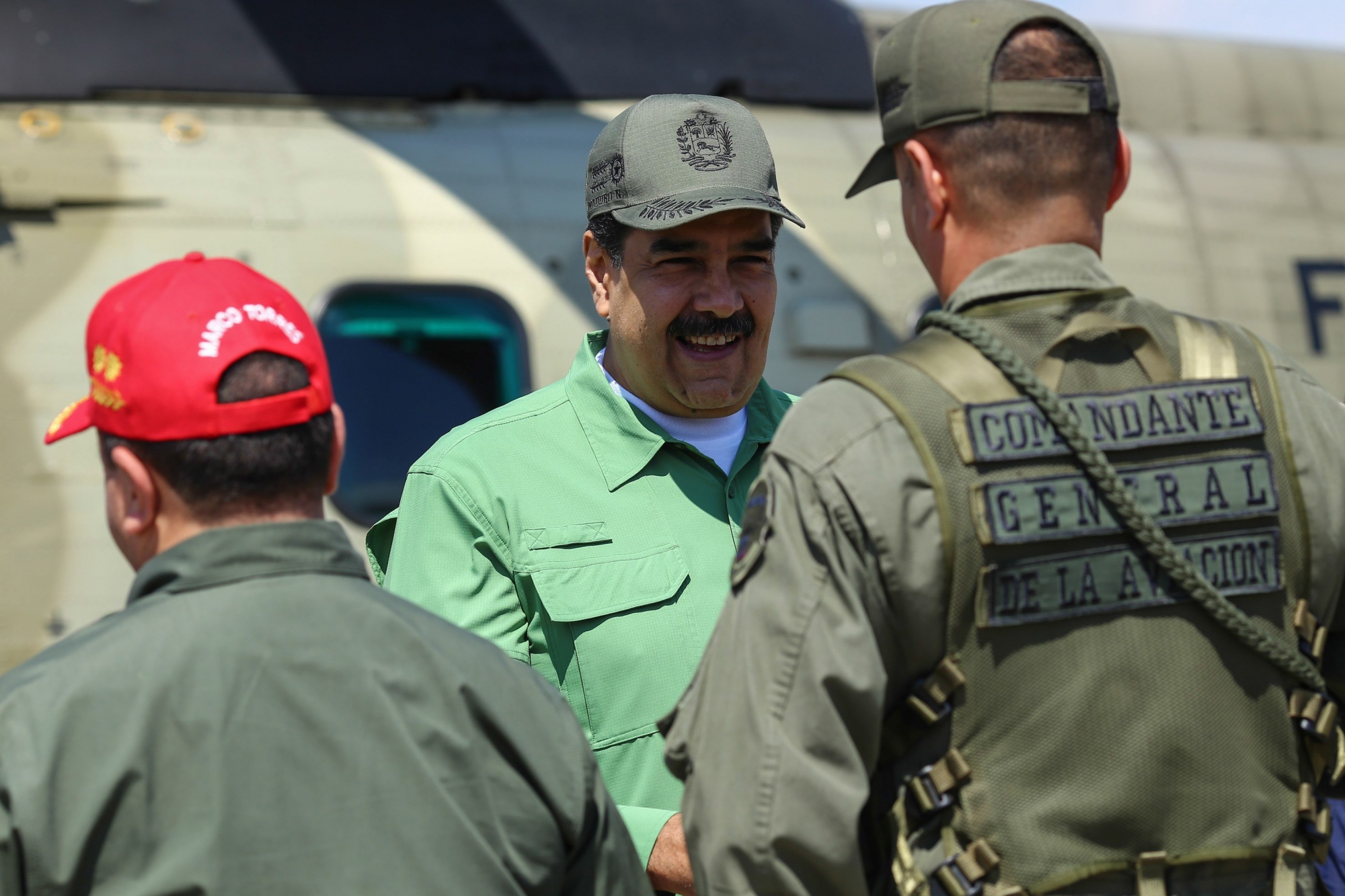 epa07330706 Handout picture made available by the Miraflores Palace which shows President of Venezuela Nicolas Maduro (C) during a visit to a military base, in Aragua, Venezuela, 29 January 2019. During the visit Maduro supervised the military exercises and in a speech described as 'childish' the foreign policy of the United States, after the US National Security Advisor John Bolton, left visible a notebook that read '5,000 troops to Colombia'.  EPA/Miraflores Press / HANDOUT  HANDOUT EDITORIAL USE ONLY/NO SALES VENEZUELA CRISIS