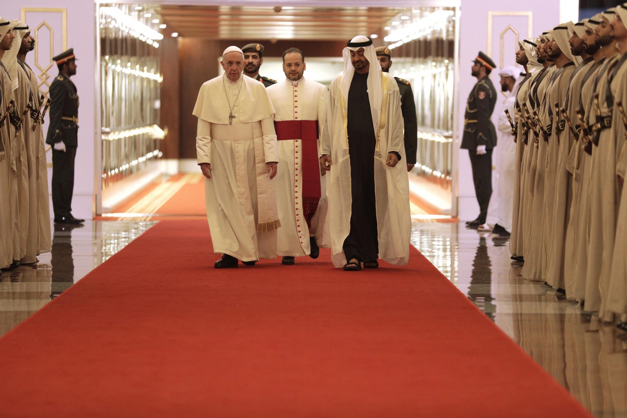 epa07340968 Pope Francis (L) is welcomed by Abu Dhabi's Crown Prince Sheikh Mohammed bin Zayed Al Nahyan, upon his arrival at the Abu Dhabi airport, United Arab Emirates, 03 February 2019.  Pope Francis arrived on three-day visit to the UAE, making him the first pontiff to visit an Arab Gulf state. He will attend an interreligious conference and lead a mass at the Zayed Sports City. The UAE is a Muslim-majority county, however there are some 1.2 million Christian expatriate population.  EPA/ANDREW MEDICHINI / POOL UAE POPE FRANCIS VISIT