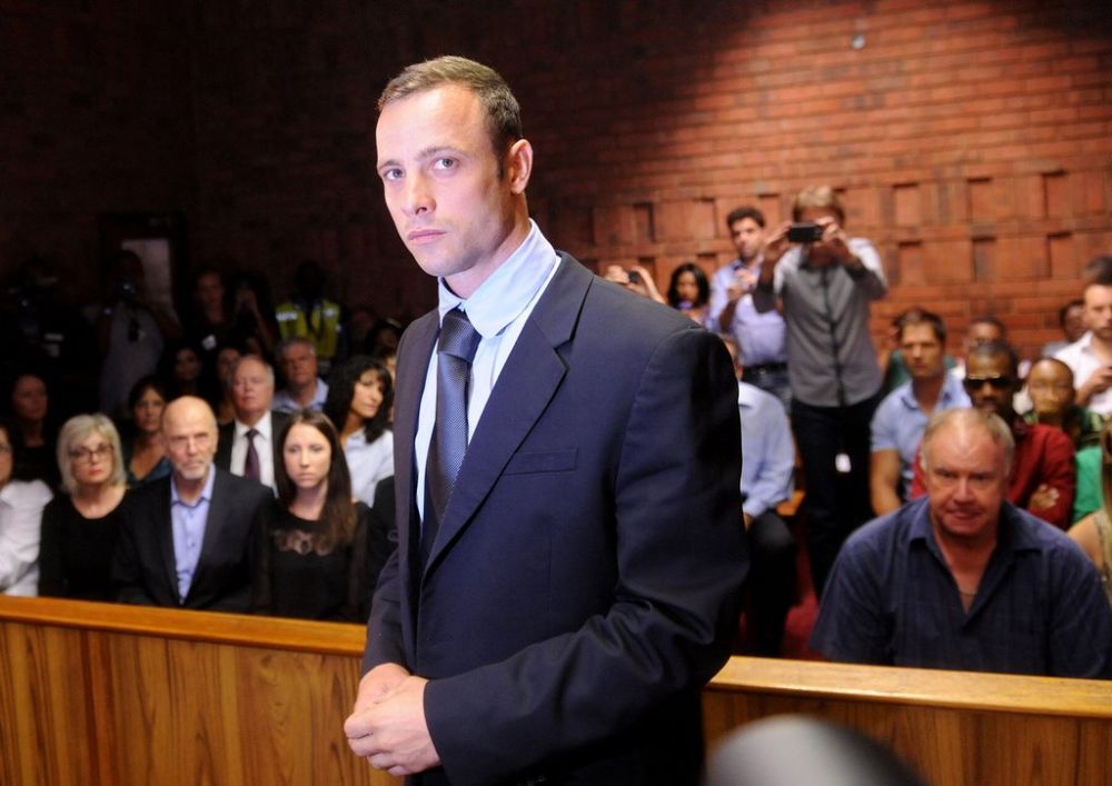Olympic athlete, Oscar Pistorius , in court Friday Feb. 22, 2013 in Pretoria, South Africa, for his bail hearing charged with the shooting death of his girlfriend, Reeva Steenkamp. The defense and prosecution both completed their arguments with the magistrate soon to rule if the double-amputee athlete can be freed before trial or if he must stay behind bars pending trial. (AP Photo/Antoine de Ras-Star) SOUTH AFRICA OUT