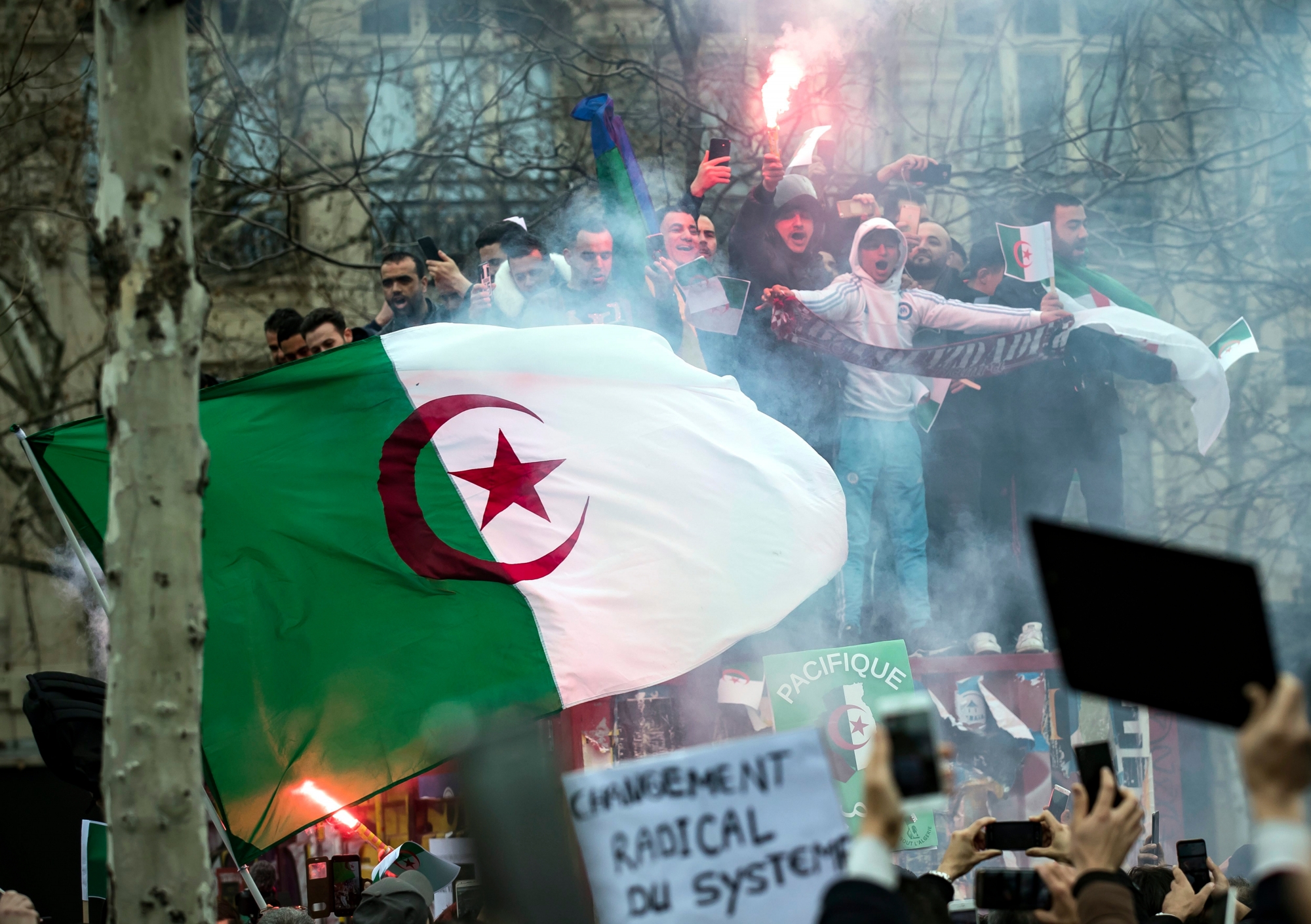 epa07411041 Members of the Algerian community in Paris protest against the fifth term of Algerian President Abdelaziz Bouteflika on Place de la Republique in Paris, France, 03 March 2019. The registration process for the upcoming presidential elections in Algeria closed on 03 March, while there was still no official confirmation as to whether the country's ailing president, whose bid for re-election sparked widespread protests, had submitted his candidacy papers. Abdelaziz Bouteflika, serving as the president since 1999, has announced on 19 February he will be running for a fifth term in presidential elections scheduled for 18 April 2019.  EPA/IAN LANGSDON FRANCE ALGERIA PROTEST BOUTEFLIKA