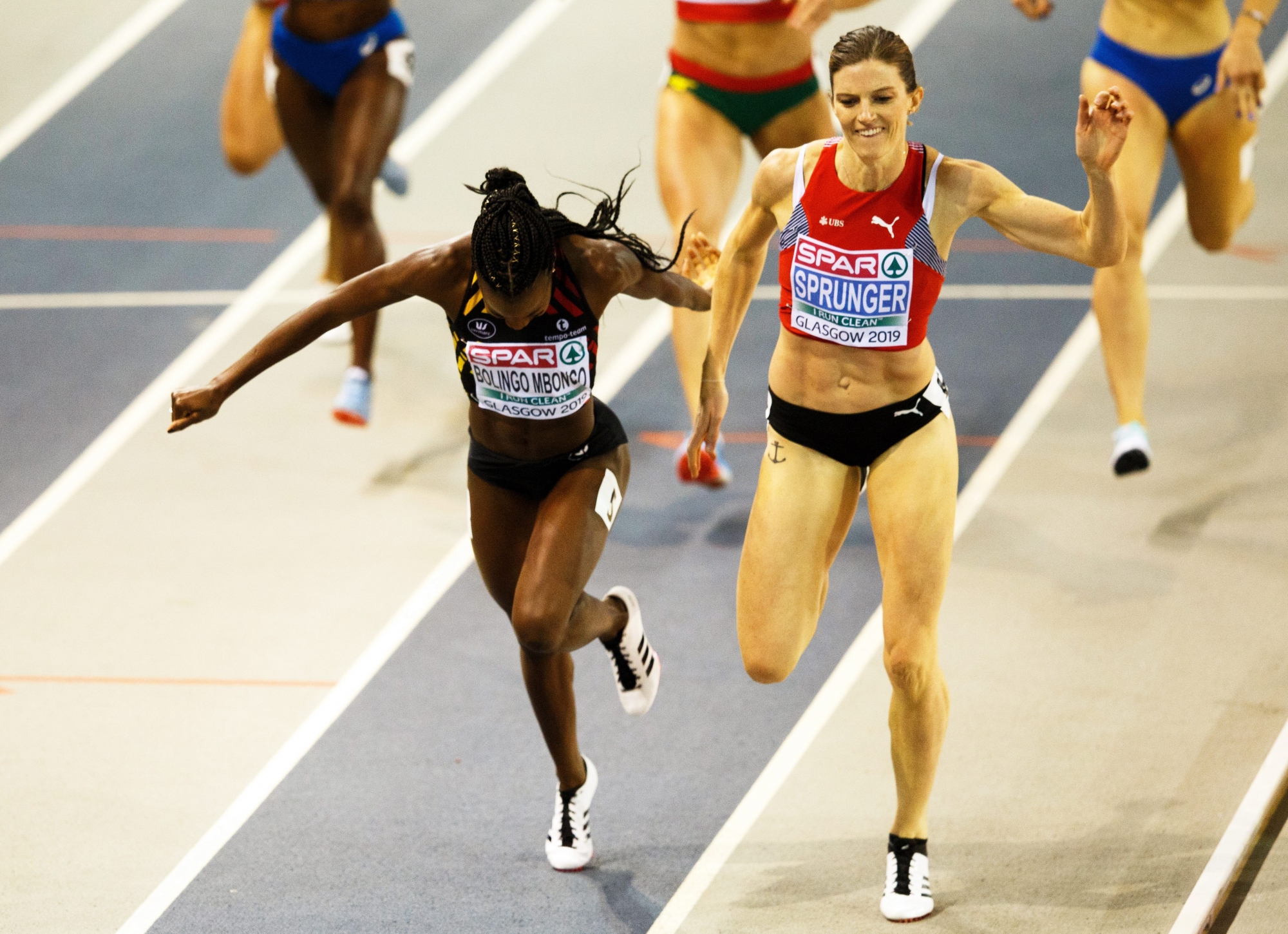 epa07409829 Lea Sprunger (R) of Switzerland crosses the finish line to win the women's 400m final ahead of second placed Cynthia Bolingo Mbongo (L) of Belgium at the 35th European Athletics Indoor Championships in Glasgow, Britain, 02 March 2019.  EPA/ROBERT PERRY BRITAIN INDOOR ATHLETICS EUROPEAN CHAMPIONSHIPS