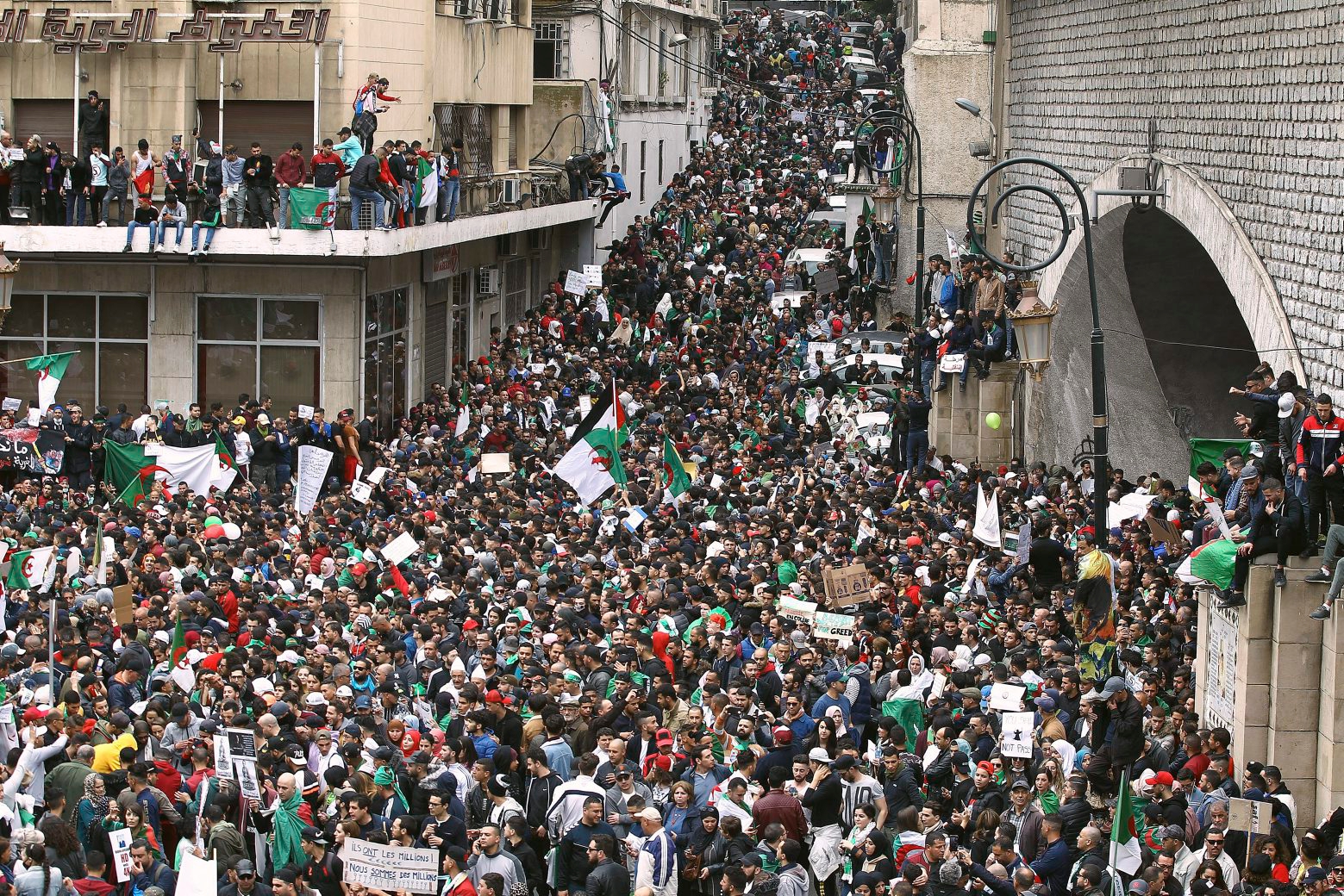 Algerians gather for a demonstration in Algiers, Friday, March 8, 2019. A festive crowd of thousands of protesters marched through central Algiers to protest President Abdelaziz Bouteflika's hold on power. The protesters are challenging Bouteflika's fitness to run for a fifth term in next month's election. (AP Photo/Fateh Guidoum) Algeria Protests