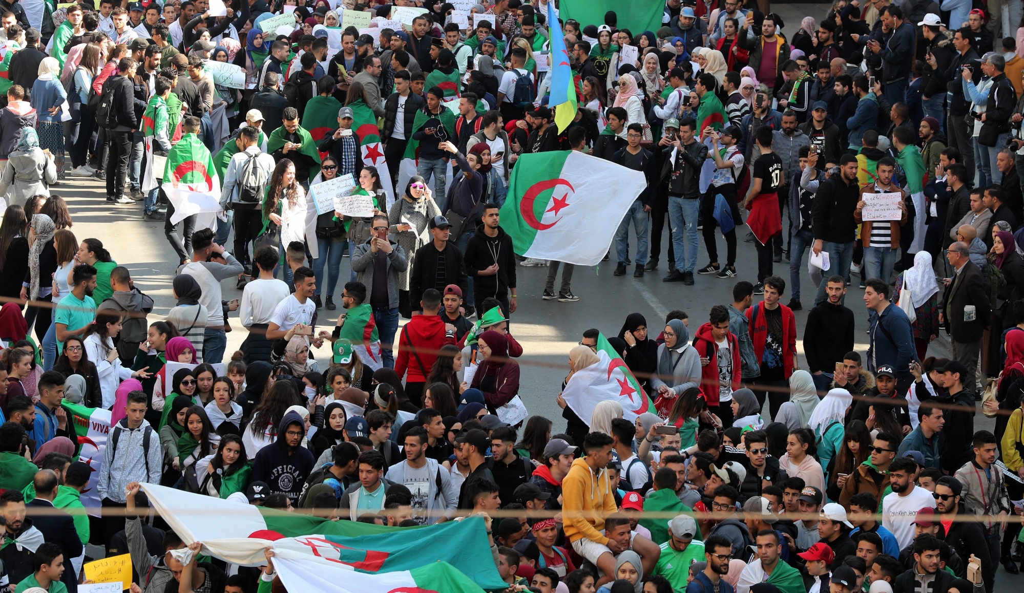 epa07430995 Algerian students protest one day after Algerian President Abdelaziz Bouteflika announced the withdrawal of his bid to run for a fifth term and postponed the elections in Algiers, Algeria, 12 March 2019. Bouteflika on 11 March announced that he will not run for a fifth Presidential term and the postponement of the presidential elections previously scheduled for 18 April 2019. Protests erupted on 22 February demanding that Bouteflika, who became President in 1999, not run for a fifth term.  EPA/MOHAMED MESSARA ALGERIA ELECTIONS BOUTEFLIKA PROTEST