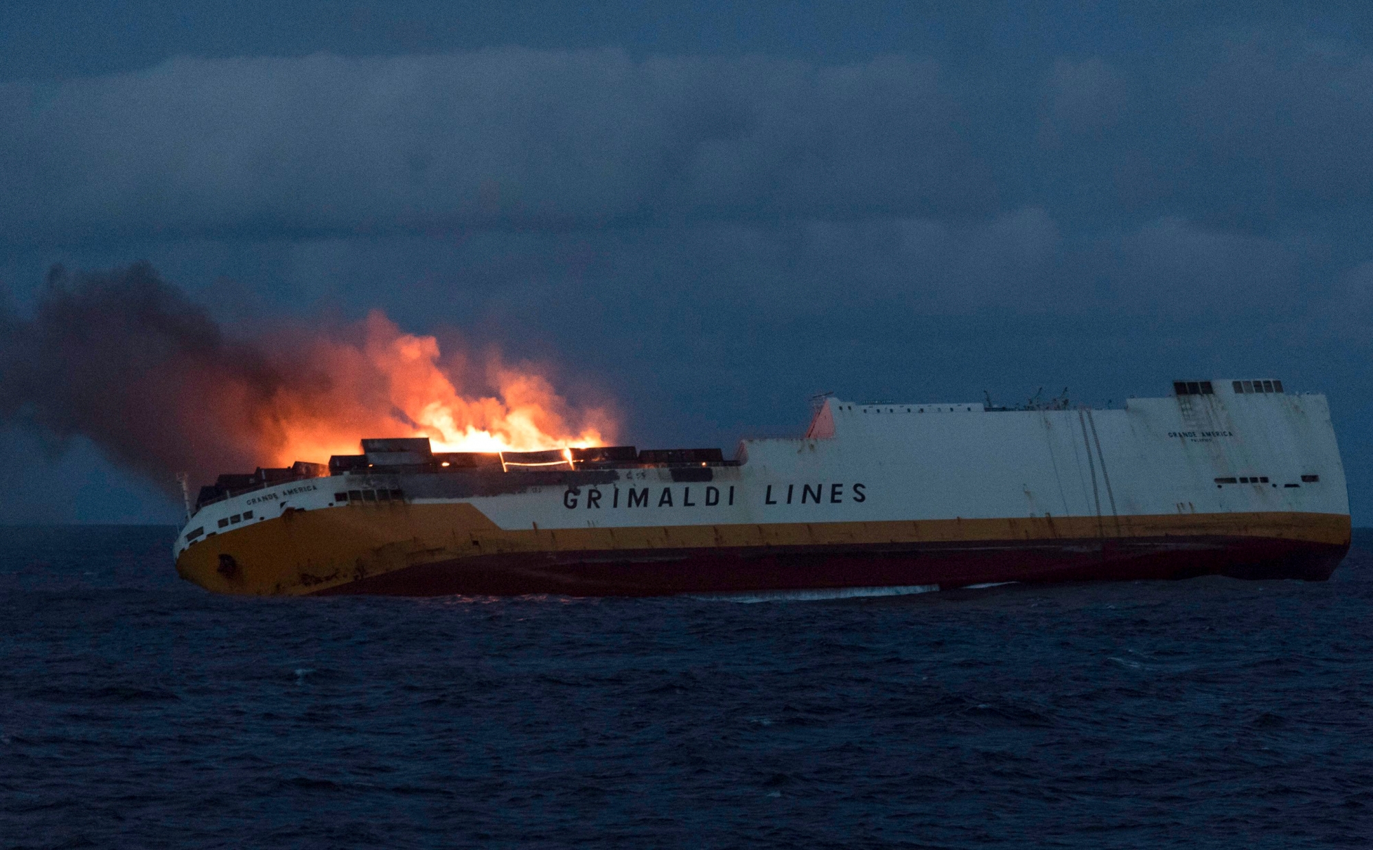 This photo provided on Thursday March 14, 2019 by the Marine Nationale, shows the Grimaldi vessel Grande America on fire in the Bay of Biscay, off the west coast of France, Monday March 11, 2019. French authorities are working to contain an oil spill off the Atlantic Coast after the Italian tanker sank following a fire. French and British rescue teams saved all 27 people aboard the Grande America tanker after it sank Tuesday. (Loic Bernardin/Marine Nationale via AP) France Oil Spill