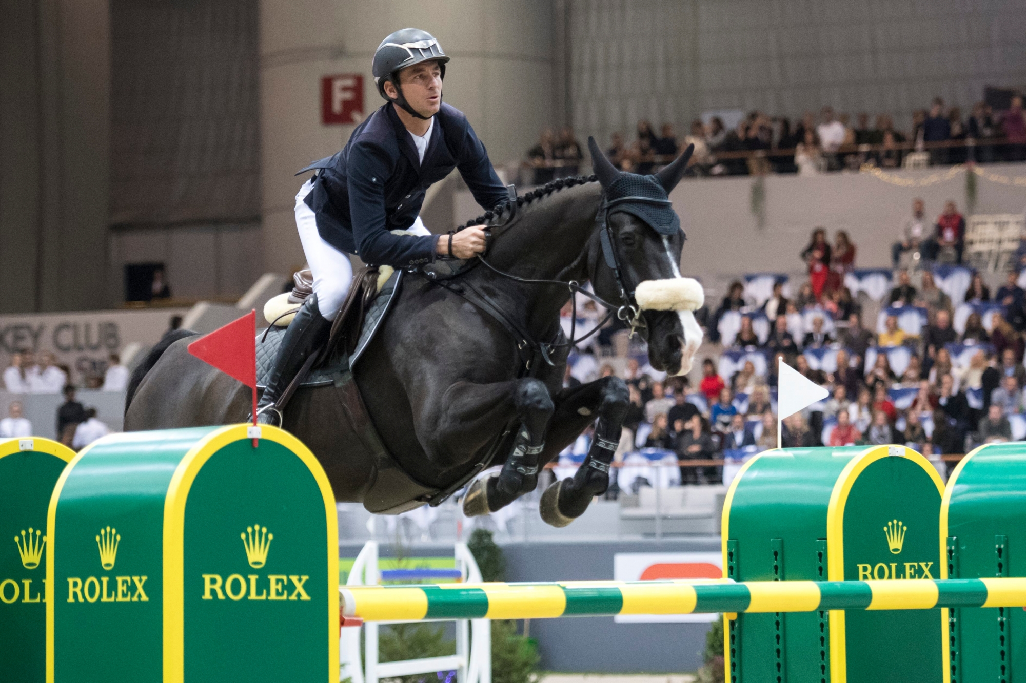 Steve Guerdat from Switzerland rides his horse Alamo to take the 1th place during the 18th top 10 IJRC at the 58nd CSI horse Show-jumping tournament in Geneva, Switzerland, on Friday, December 7, 2018. (KEYSTONE/Adrien Perritaz) SWITZERLAND GENEVA CSI IJRC HORSE SHOW JUMPING