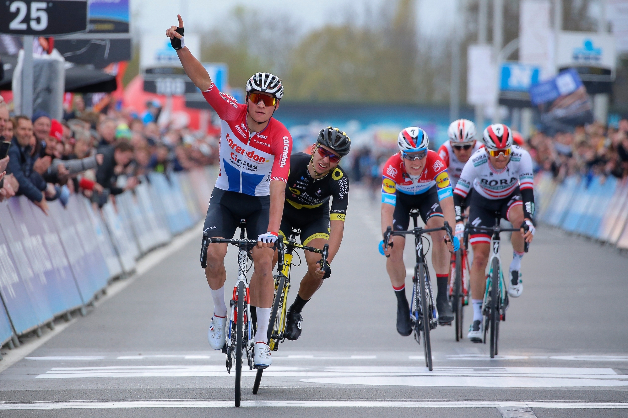 epa07482702 Dutch cyclist Mathieu Van der Poel (L) of Corendon-Circus celebrates winning the 74th edition of the 'Dwars Door Vlaanderen' one day cycling race, over 180km from Roeselare to Waregem, Belgium,  03 April 2019.  EPA/JULIEN WARNAND BELGIUM CYCLING DWARS DOOR VLANDEREN