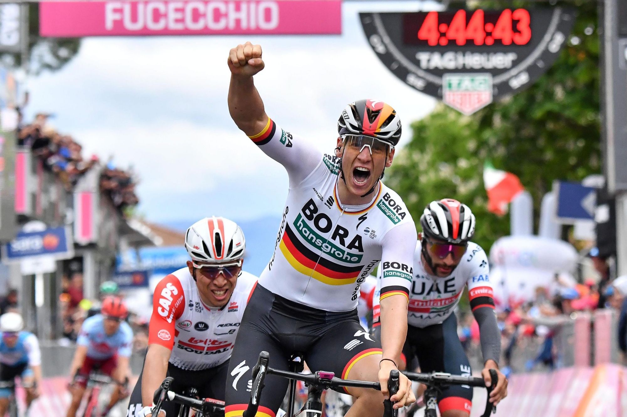 epa07564825 German cyclist Pascal Ackermann (C) of Bora-hansgrohe team celebrates winning the second stage of the Giro d'Italia cycling race, over 205km between Bologna and Fucecchio, Italy, 12 May 2019.  EPA/ALESSANDRO DI MEO ITALY CYCLING GIRO D'ITALIA
