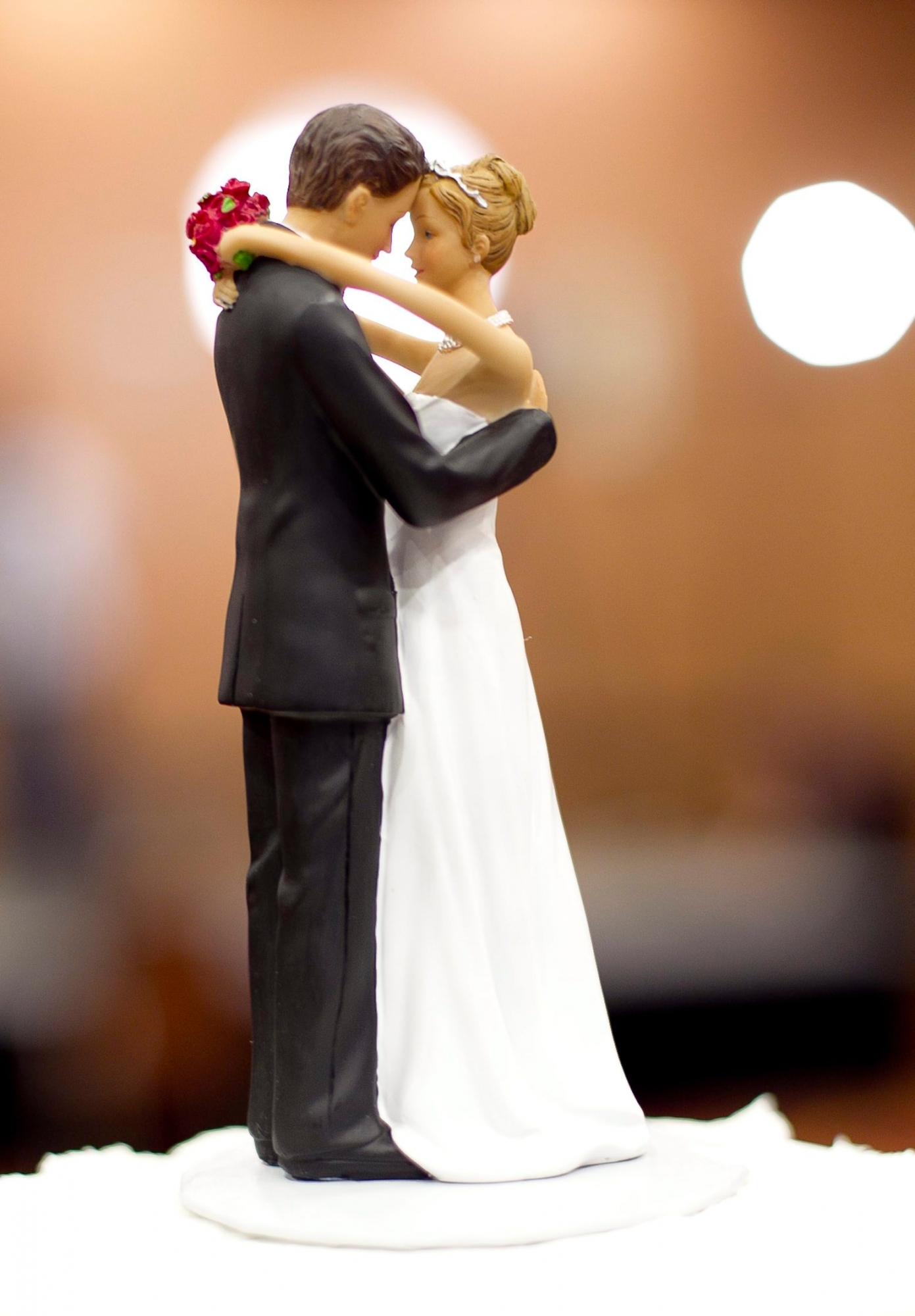A figurine of a bride and a groom sits atop a wedding cake during an election watch party at the N. Raleigh Hilton in Raleigh, N.C., on Tuesday May 8, 2012. The national debate over gay marriage focused on North Carolina, as voters  made it the 29th state to pass a constitutional amendment defining marriage as solely between a man and a woman. (AP Photo/The News & Observer, Robert Willett) Gay Marriage Amendment