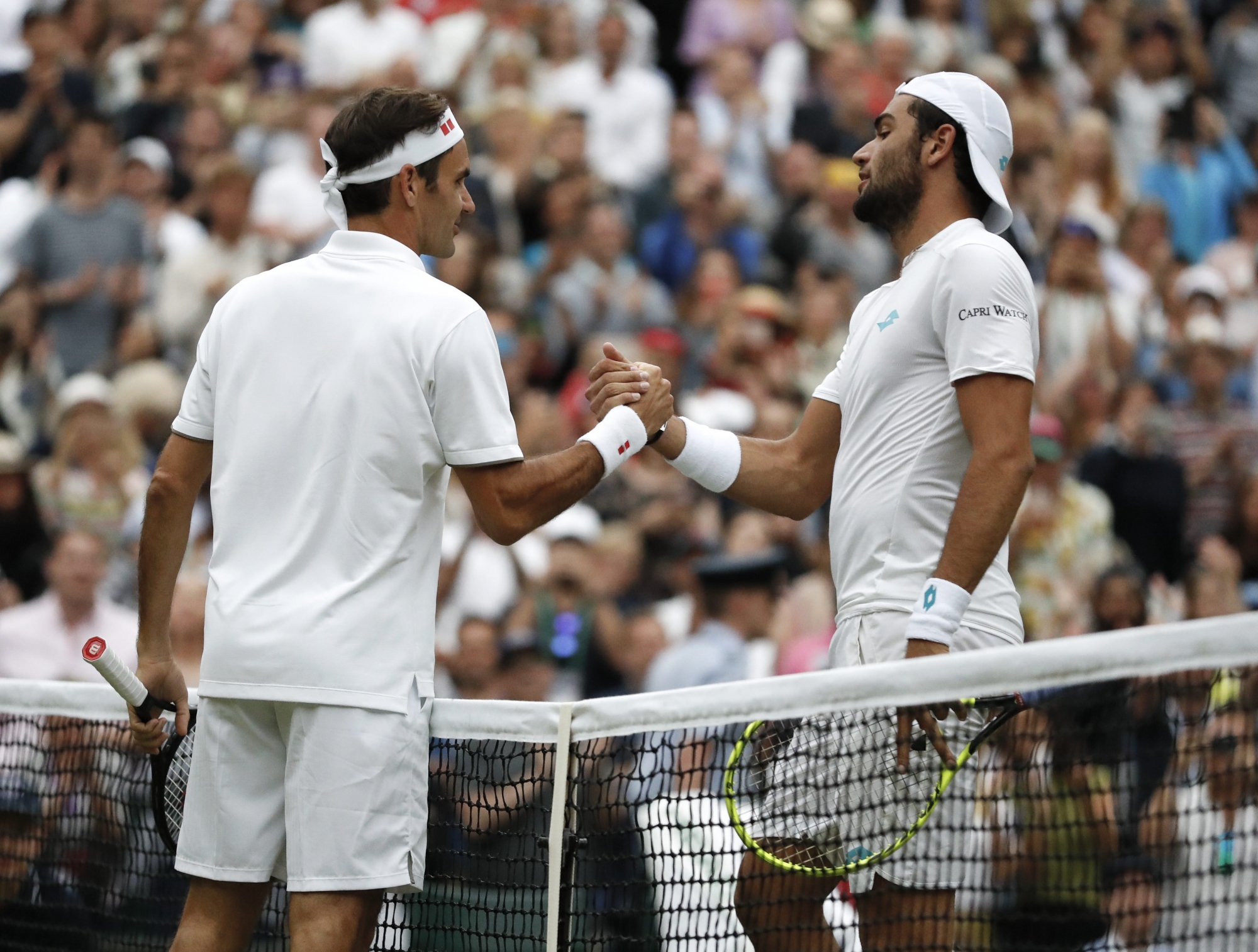 "C'est combien la leçon" a demandé Matteo Berrettini (à droite) à Roger Federer.