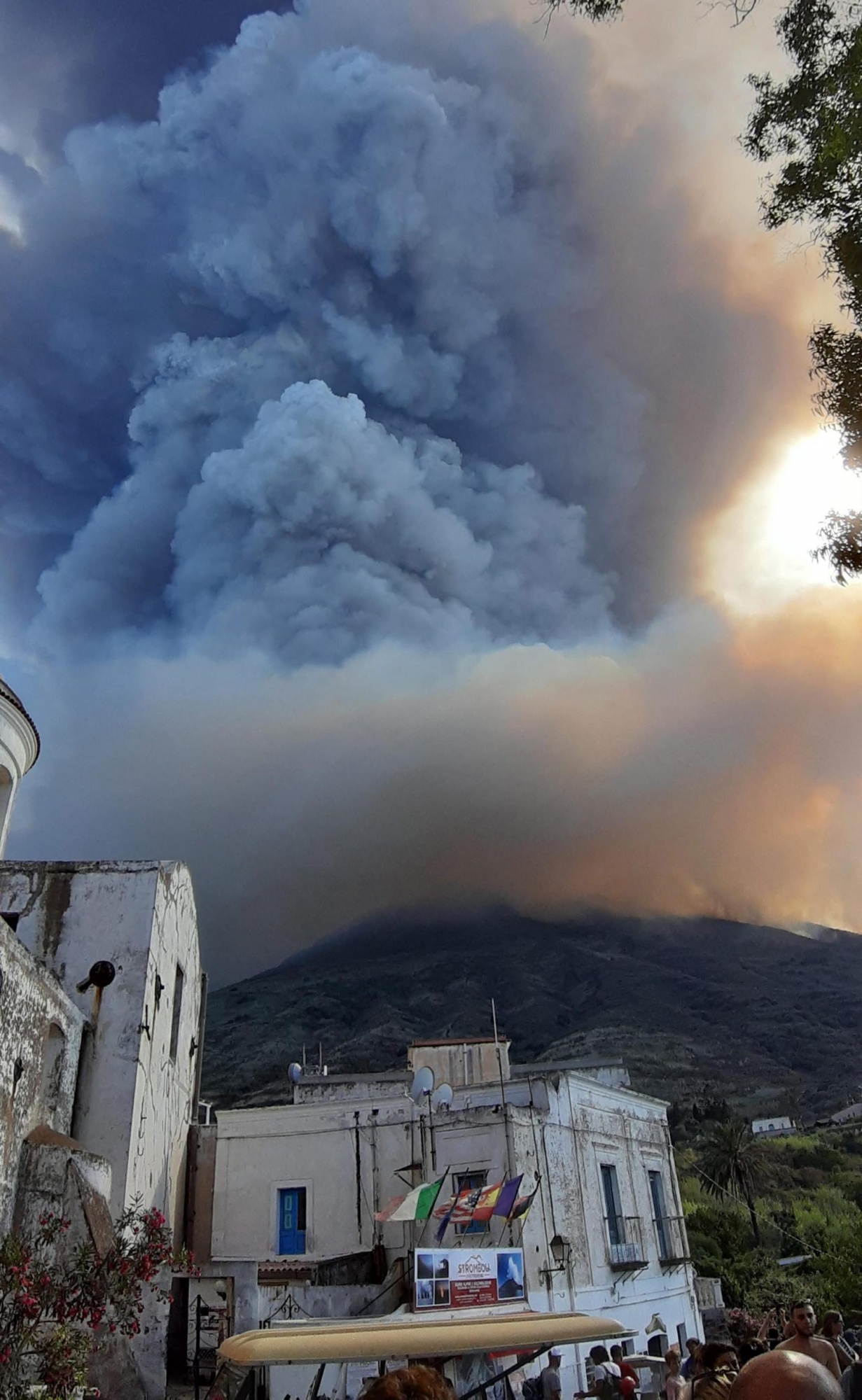 epa07692554 Ash rises into the sky after a volcano eruption on a small island of Stromboli, Italy, 03 July 2019. According to reports, the island of Stromboli was hit by a set of violent volcano eruptions spurring beach tourists to take into the sea. Two new lava spouts are creeping down the volcano.  EPA/NICOLA MARCHISIO ITALY VOLCANO