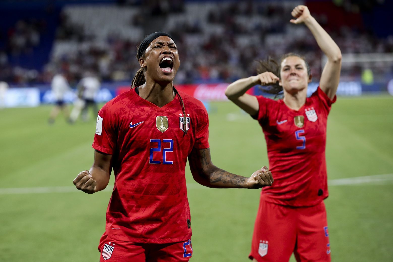 United States' Jessica Mcdonald, left, and Kelley O Hara celebrate after winning the Women's World Cup semifinal soccer match against England, at the Stade de Lyon outside Lyon, France, Tuesday, July 2, 2019. (AP Photo/Francisco Seco) France England US WWCup Soccer