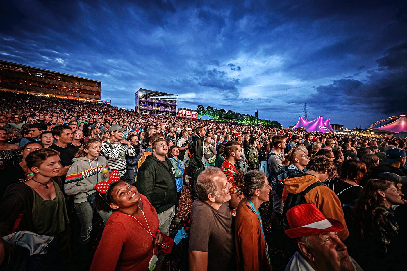 Festival goers watch Swiss humorists Vincent Kucholl and Vincent Veillon (not pictured) perform their show "Le Fric" on the main stage, during the 44th edition of the Paleo Festival, in Nyon, Switzerland, Thursday, July 25, 2019. The Paleo is a open-air music festival in the western part of Switzerland welcoming approximately 230'000 spectators over six days and takes place from July 23rd to July 28th. (KEYSTONE/Valentin Flauraud) SCHWEIZ PALEO FESTIVAL 2019