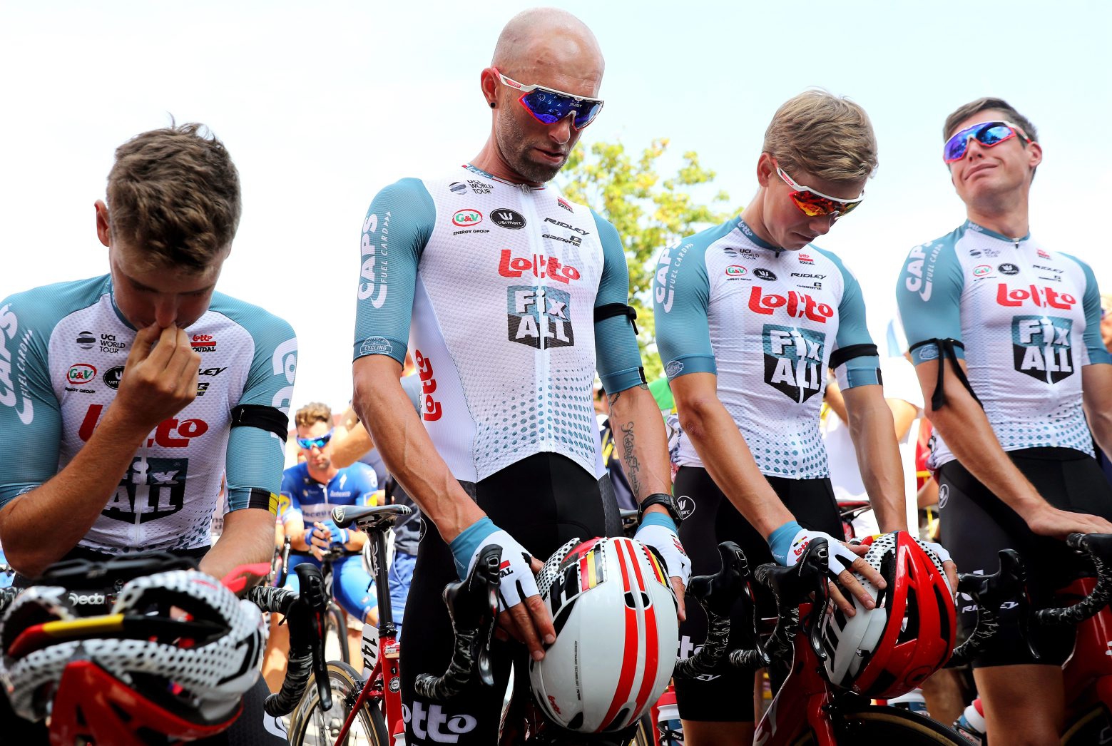 epa07758838 Riders of the Lotto Soudal team hold a minute of silence for their Belgian teammate Bjorg Lambrecht at the start of the fourth stage of the Tour de Pologne cycling race over 133.7km from Jaworzno to Kocierz, Poland, 06 August 2019. Bjorg Lambrecht, aged 22, of the Lotto Soudal team, crashed into a concrete culvert on the road during the third stage of the race. He was resuscitated and taken to hospital in Rybnik, where he died of his injuries. The organisers shortened the fourth stage by a 38.5km loop around Kocierz. The stage was also neutralized to pay respects to Lambrecht.  EPA/ANDRZEJ GRYGIEL POLAND OUT POLAND CYCLING TOUR DE POLOGNE