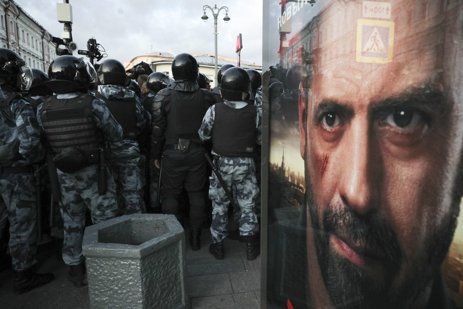 Police block a street during a protest in Moscow, Russia, Saturday, Aug. 10, 2019.  Tens of thousands of people rallied in central Moscow for the third consecutive weekend to protest the exclusion of opposition and independent candidates from the Russian capital's city council ballot. (AP Photo) Russia Protest