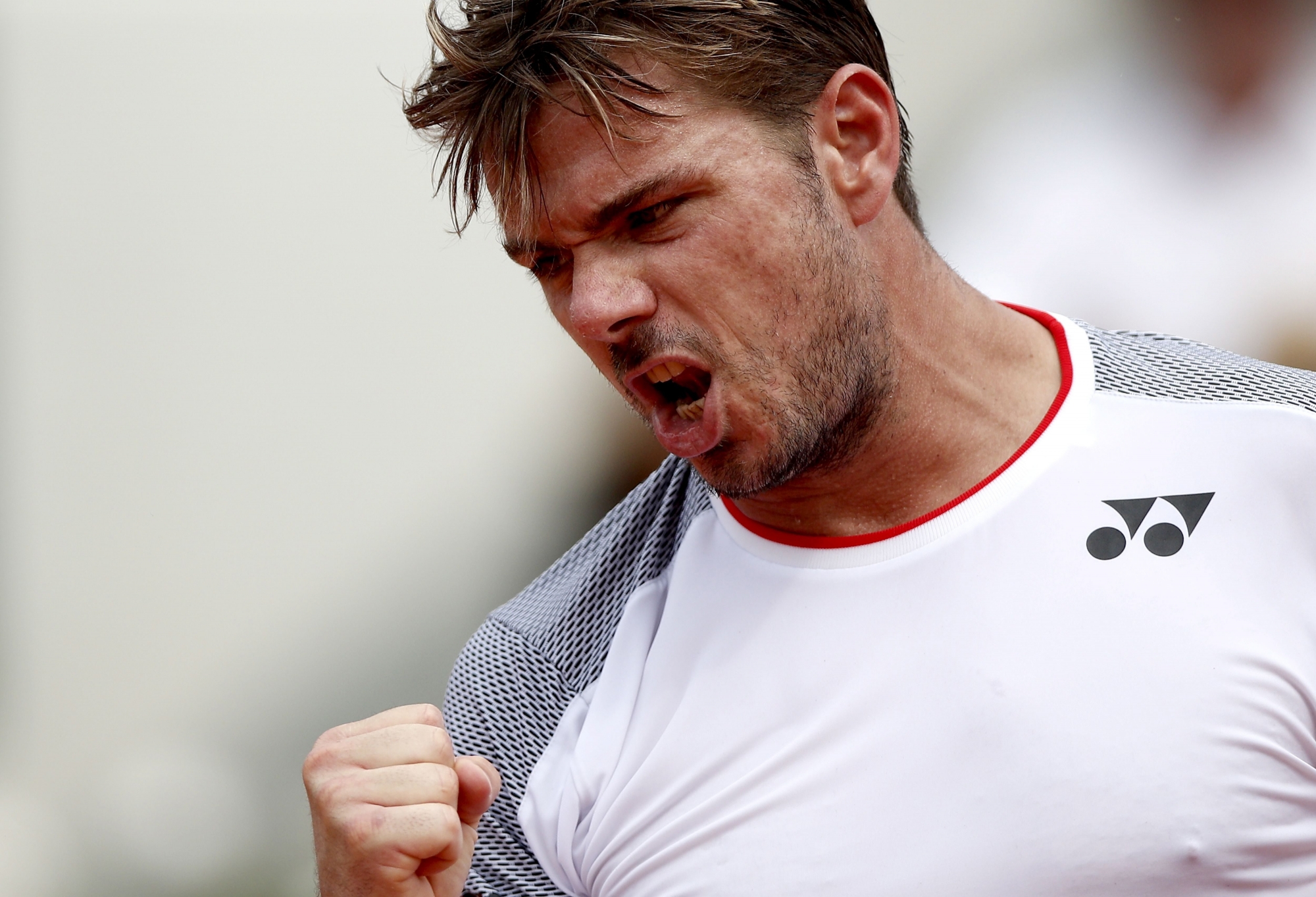 epa07624967 Stan Wawrinka of Switzerland reacts as he plays Roger Federer of Switzerland during their men's quarter final match during the French Open tennis tournament at Roland Garros in Paris, France, 04 June 2019. EPA/YOAN VALAT TENNIS FRENCH OPEN 2019