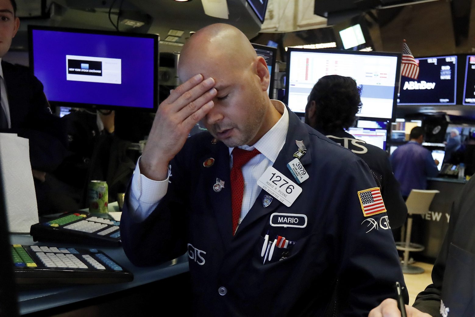Specialist Mario Picone works on the floor of the New York Stock Exchange, Wednesday, Aug. 14, 2019. The Dow Jones Industrial Average sank 800 points after the bond market flashed a warning sign about a possible recession for the first time since 2007. (AP Photo/Richard Drew)
Mario Picone Financial Markets Wall Street