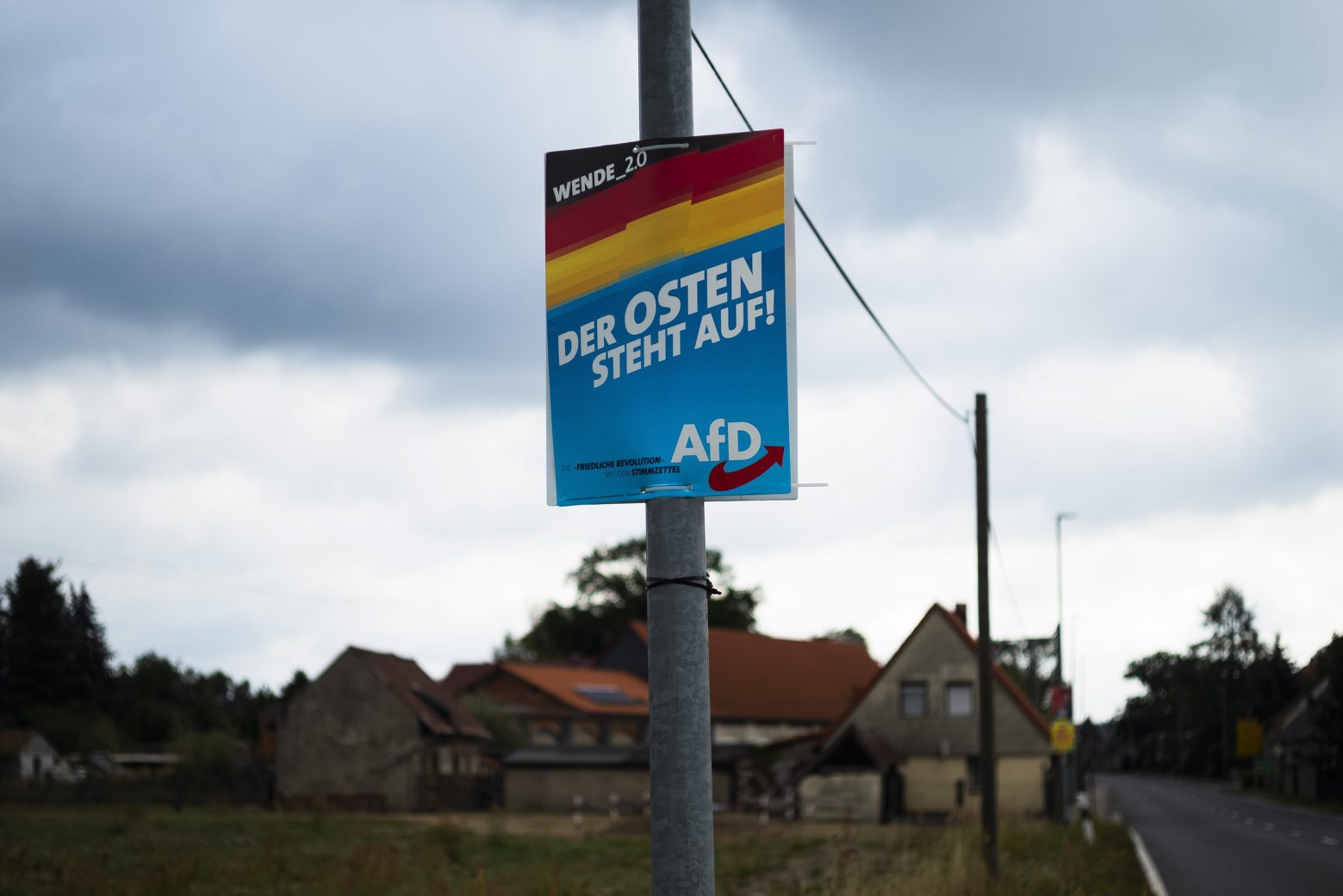 In this Friday, Aug. 16, 2019 photo an election campaign poster of German Alternative for Germany, AfD, party for the Saxony state election reading: ÄöThe East stands up' is displayed in the village Gruenwald near Bautzen, Germany. Two elections in eastern Germany's states Brandenburg and Saxony on Sept. 1, 2019 look set to bring big gains for the far-right Alternative for Germany party and another blow to the traditional parties that form the national government. (AP Photo/Markus Schreiber) Germany Elections