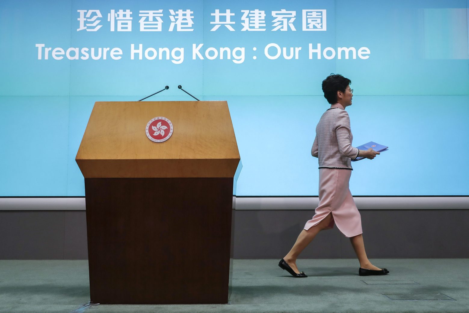 Hong Kong Chief Executive Carrie Lam leaves the stage after a press conference at the Legislative Council in Hong Kong Wednesday, Oct. 16, 2019. In chaotic scenes, furious pro-democracy lawmakers twice forced Hong Kong's leader to stop delivering a speech laying out her policy objectives and clamored for her to resign after she walked out of the legislature on Wednesday and then delivered the annual address 75 minutes late via television. (AP Photo/Mark Schiefelbein)
Carrie Lam Hong Kong Protests