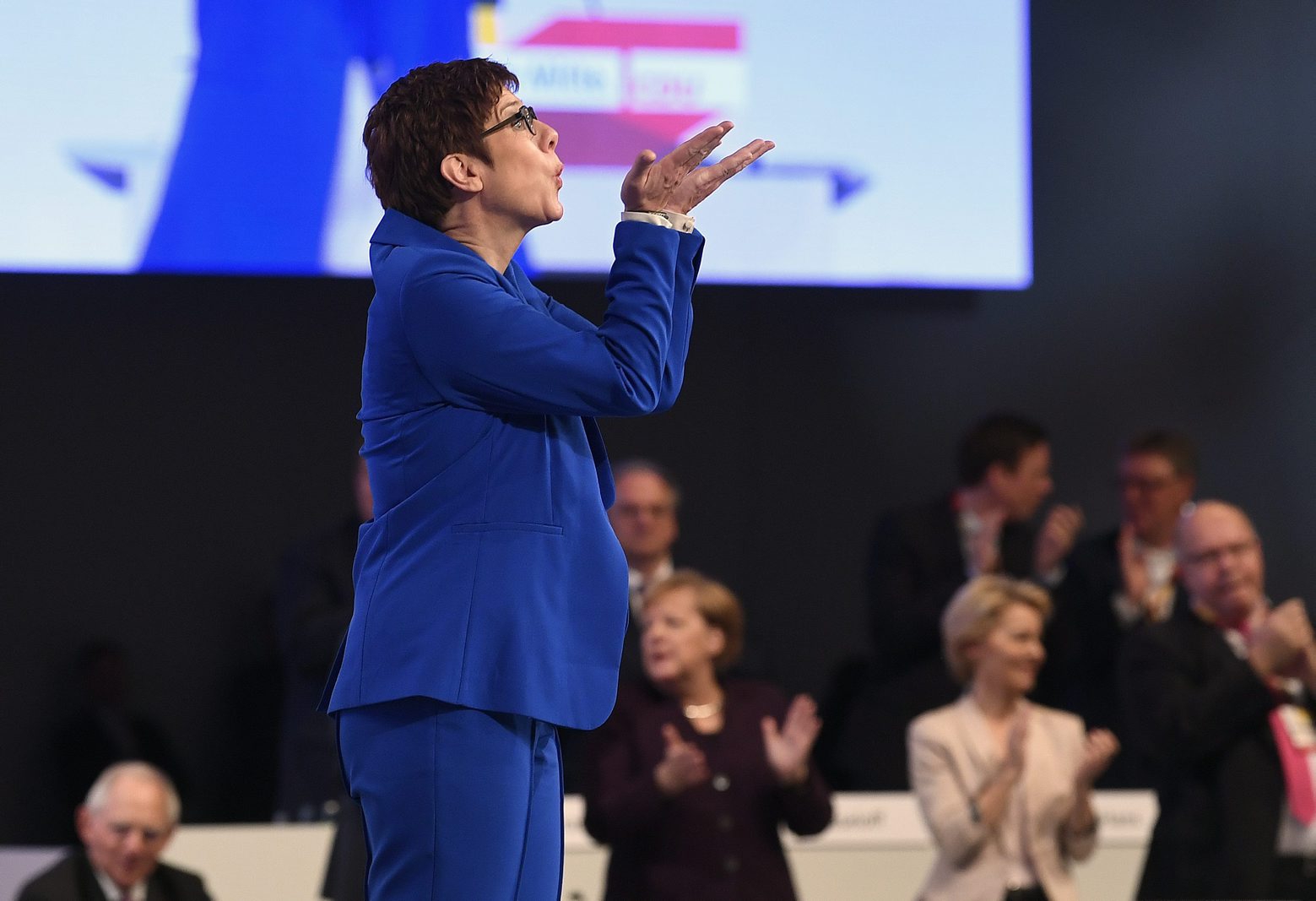 CDU party chairwoman Annegret Kramp-Karrenbauer reacts as she receives standing ovations at the German Christian Democrats Party (CDU) convention in Leipzig, Germany, Friday, Nov. 22, 2019. The CDU convention takes place from Friday, Nov. 22, to Saturday, Nov. 23, 2019. (AP Photo/Jens Meyer) Germany Merkel's Party