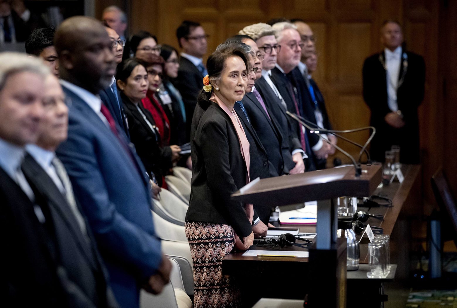 epaselect epa08059167 Myanmar State Counselor Aung San Suu Kyi (C) appears before the International Court of Justice (ICJ) as Abubacarr Tambadou (3-L), minister of justice of The Gambia, looks on, at the Peace Palace in The Hague, Netherlands, 10 December 2019. Suu Kyi will defend her country against accusations of genocide filed by The Gambia, following the 2017 Myanmar military crackdown on the Rohingya Muslim minority.  EPA/KOEN VAN WEEL epaselect NETHERLANDS MYANMAR TRIAL