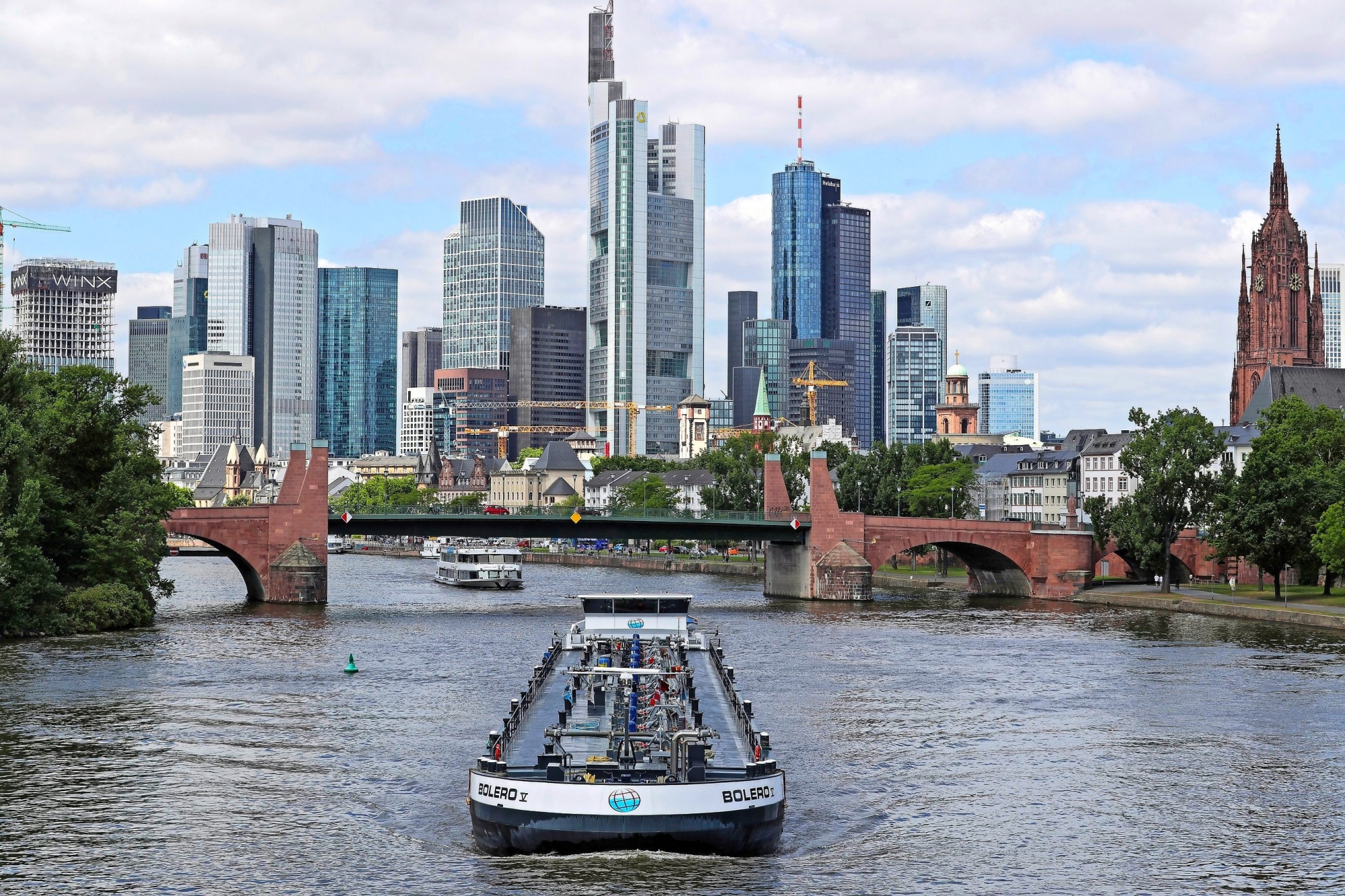 epa06771088 (FILE) - River barge 'Bolero V' navigates on Main river in Frankfurt Main, Germany, 13 July 2017 with the city financial district and high-rise bank buildings on background (re-issued 29 May 2018). Reports on 29 May 2018 state European banking sector shares are suffering from being hit by the continuing political crisis and uncertainty in Italy. The Euro Stoxx banking index suffered a loss of 4.6 per cent. Shares of major lenders suffered losses, among them Deutsche Bank that was 4.5 per cent down, and Unicredit that saw their share price slide 6.6 per cent.  EPA/ARMANDO BABANI (FILE) GERMANY ECONOMY ITALY