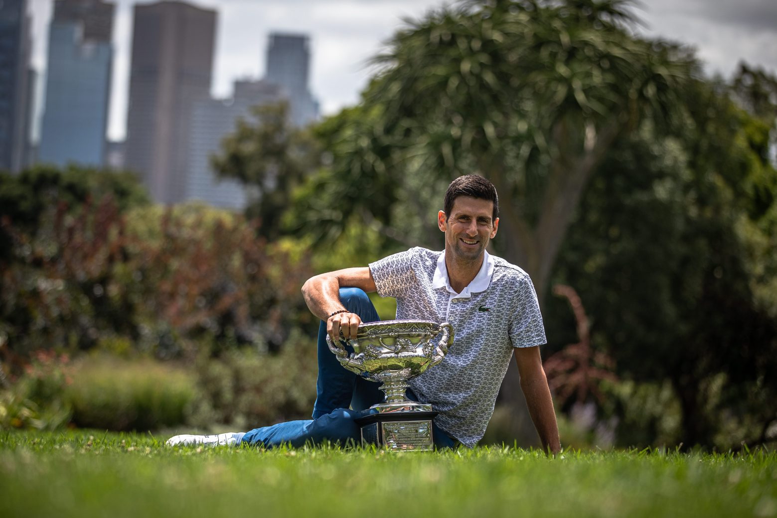 epa08189648 Novak Djokovic of Serbia poses for photos with the Norman Brookes Challenge Cup the day after winning the Men's Singles Final at the Australian Open grand slam tennis tournament, in Melbourne, Australia, 03 February 2020.  EPA/ROMAN PILIPEY AUSTRALIA TENNIS AUSTRALIAN OPEN GRAND SLAM
