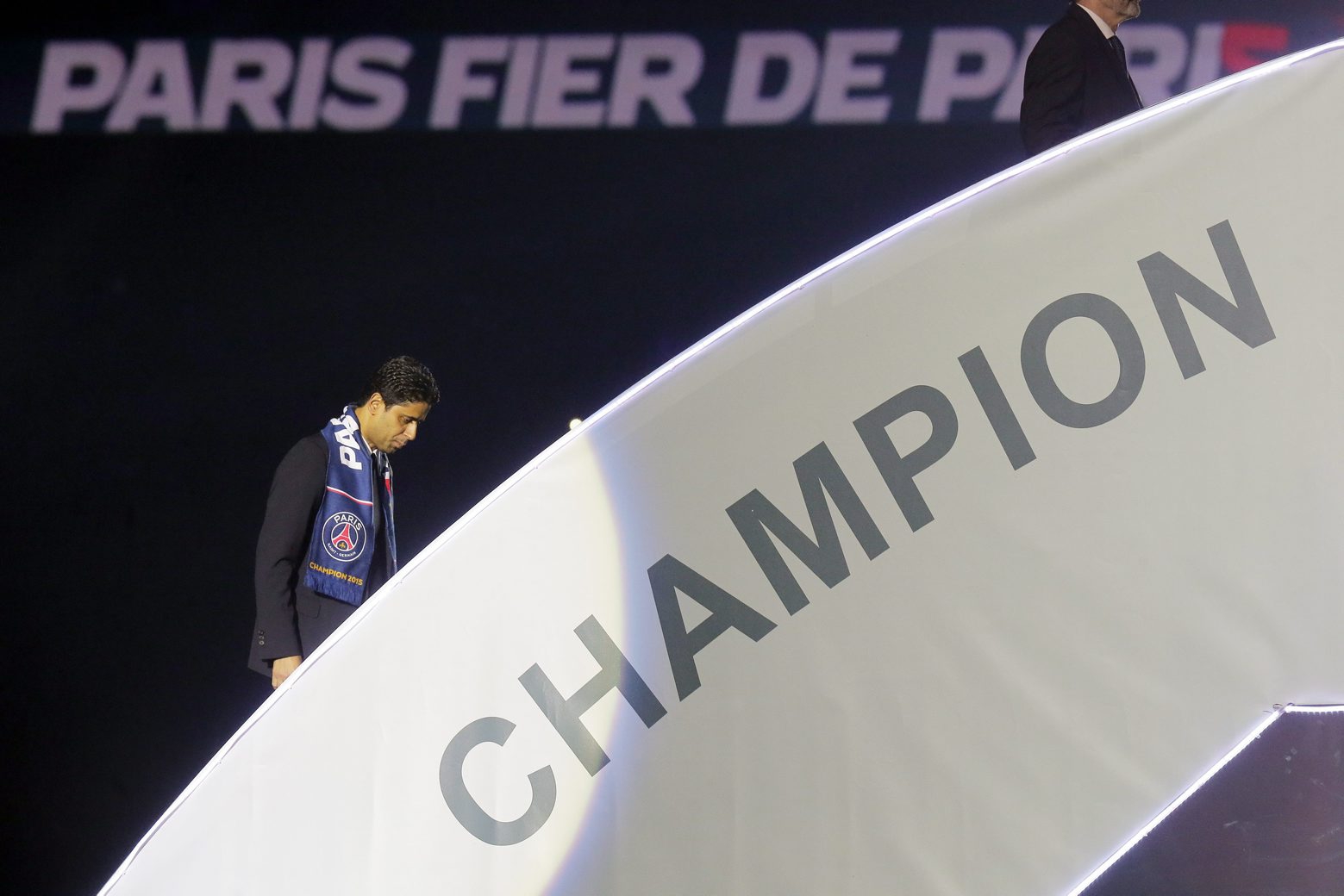 FILE - In this Saturday, May 23, 2015 file photo Nasser Al-Khelaifi walks on to the podium after winning the French League One title at the end of the French L1 football match Paris Saint-Germain (PSG) and Reims, at the Parc des Princes Stadium, in Paris. Paris Saint-Germain president Nasser al-Khelaifi was charged Thursday Feb. 20, 2020 by Swiss federal prosecutors in connection with a wider bribery investigation linked to World Cup television rights. (AP Photo/Jacques Brinon, File) Soccer FIFA Investigation Al-Khelaifi