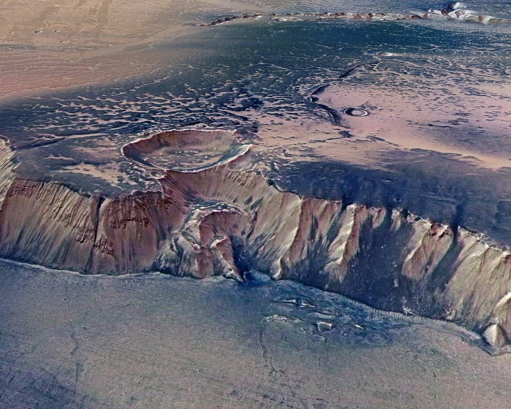 Cette image fournie par l'Agence spatiale européenne montre une photo d'Echus Chasma, l'une des plus grandes régions de sources d'eau de la planète rouge. Cette vallée, qui ressemble au Grand Canyon de l'Arizona, mesure environ 100 km de long et 10 km de large (archives).